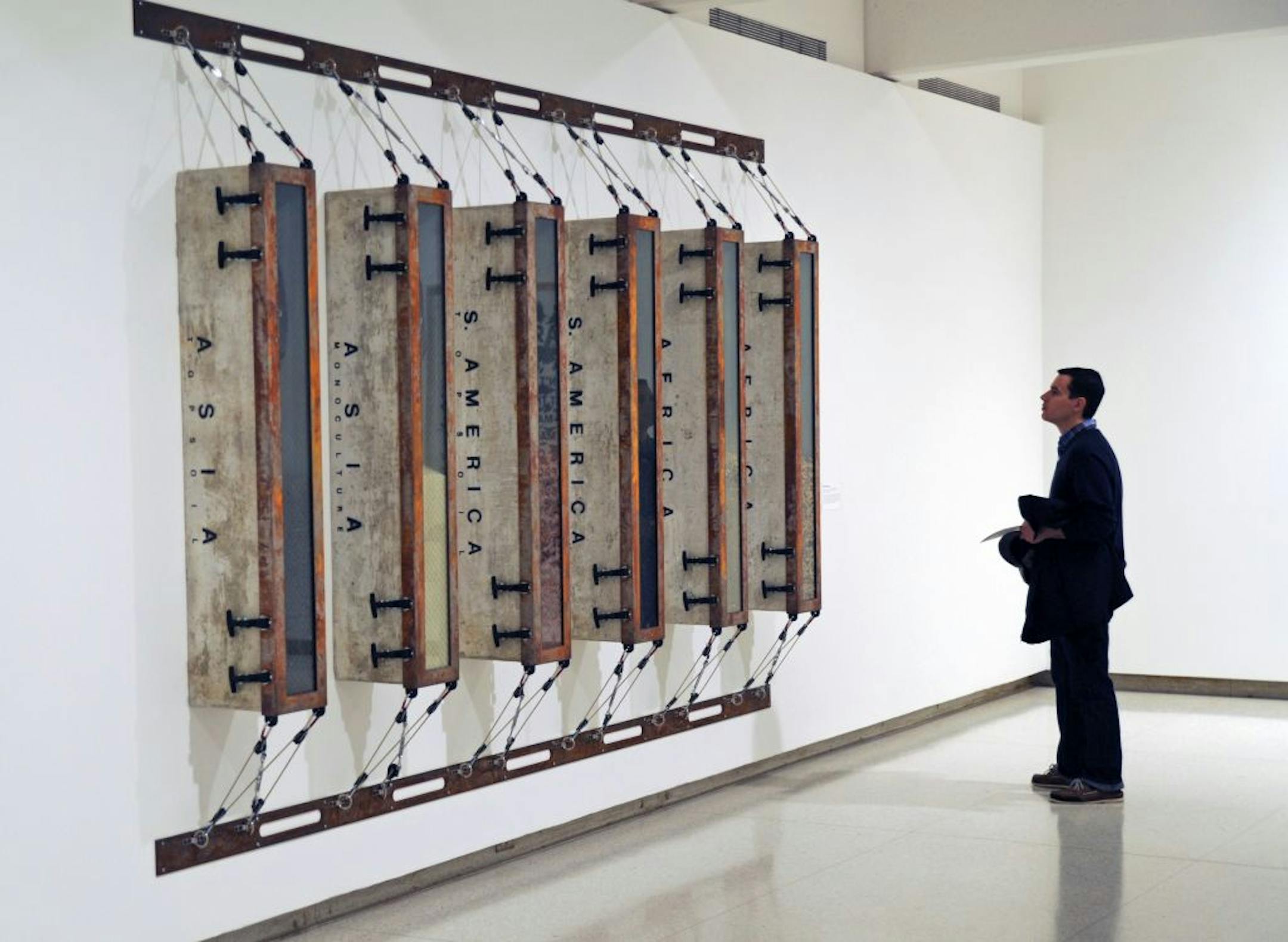 Minamalism's Evil Orthodoxy Monoculture's Totalitarian Esthetic # 1 by Ashley Bickerton display art for review of new installation of WAC collection in galleries 1 - 3