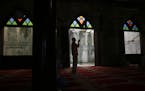 A Shia Muslim man offers afternoon Ramadan prayers at a mosque in Mumbai, India, Thursday, June 25, 2015. Muslims throughout the world are marking the