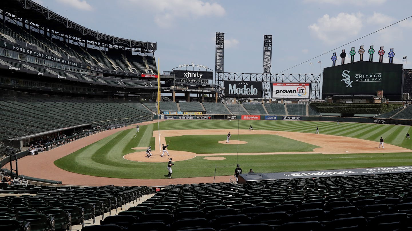 The Chicago White Sox take part in baseball practice at Guaranteed Rate Field in Chicago, Thursday, July 9, 2020. (AP Photo/Nam Y. Huh)