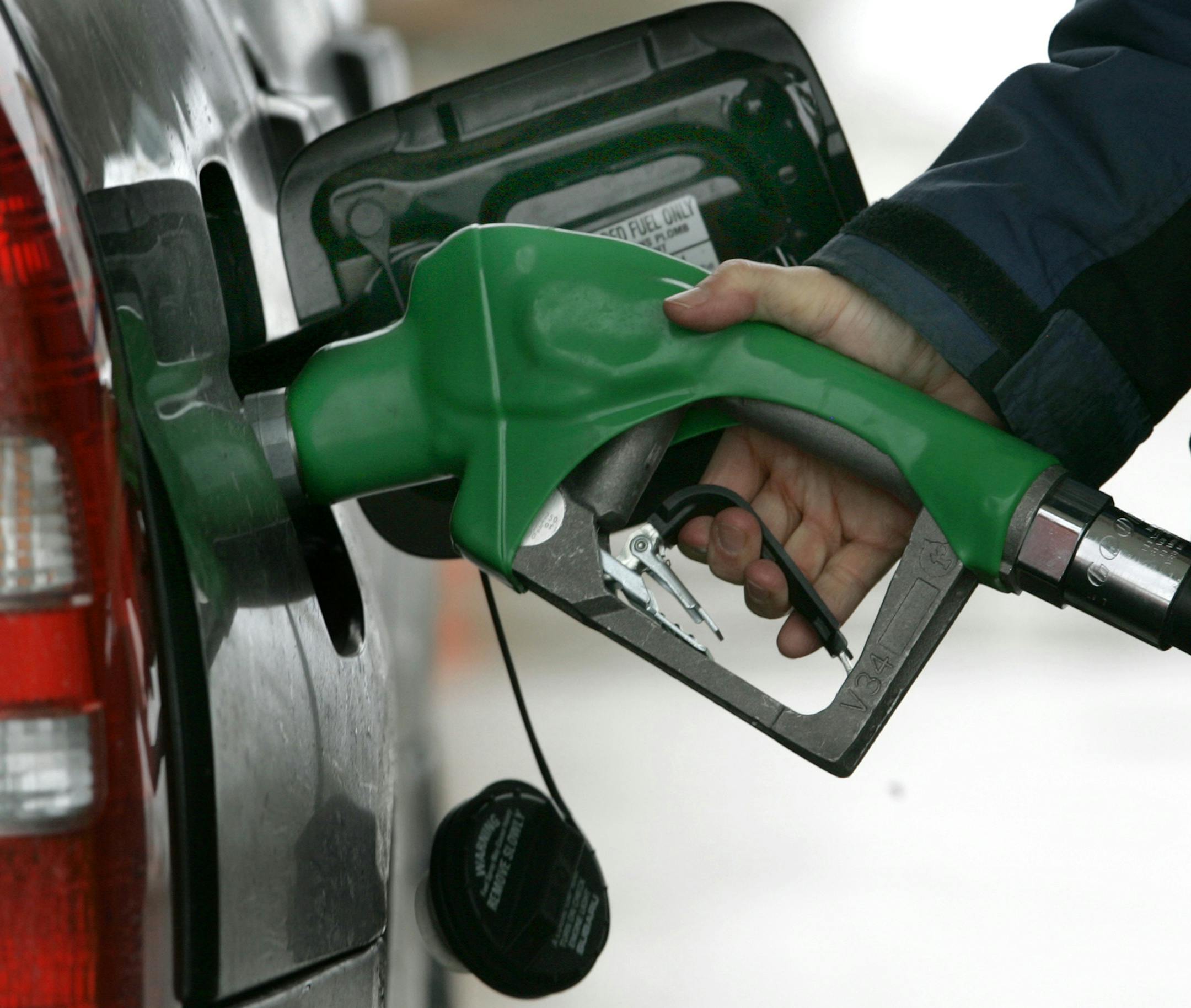 A customer pumps gasoline into her car at the BP station in Bainbridge Twp., Ohio on Monday, March 10, 2008. Oil prices surged Monday above $108 to a new inflation-adjusted record and their fifth new high in the last six sessions on an upbeat report on wholesale inventories. (AP Photo/Amy Sancetta) ORG XMIT: OHAS102 ORG XMIT: MIN2017010313214026