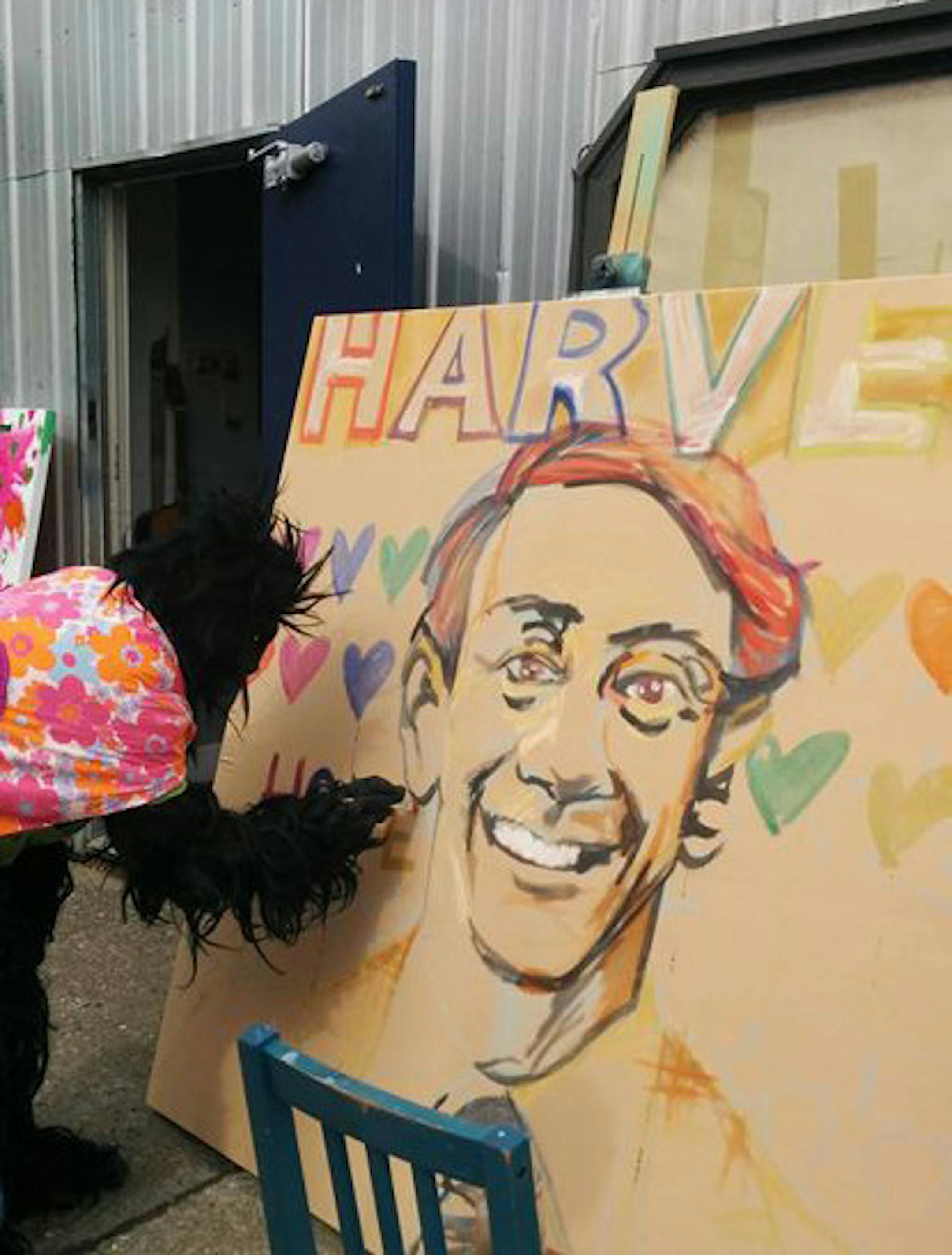The author happened upon Calgary’s Gay Pride parade, where someone dressed as a gorilla painted a portrait of Harvey Milk.