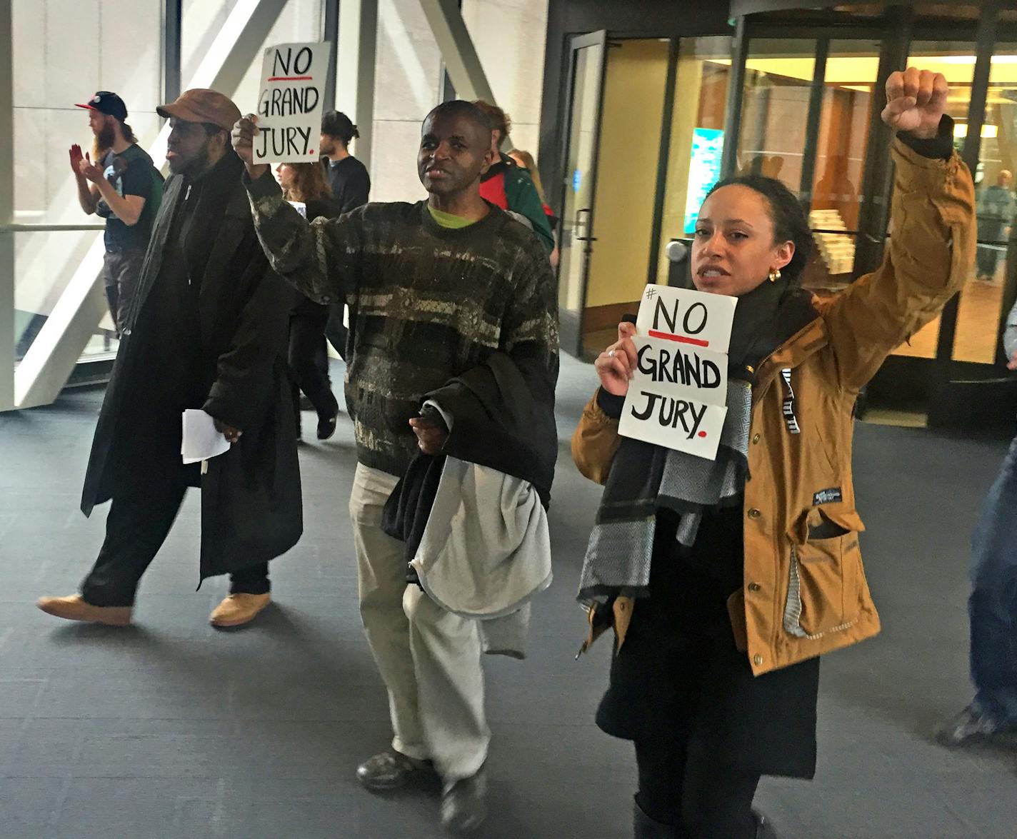 60 protesters marched through the Minneapolis skyway system, Friday, demanding Hennepin County Mike Freeman prosecute two police officers in Jamar Clark's shooting death without taking case to a grand jury. ] Randy Furst Star Tribune 2/19/2016