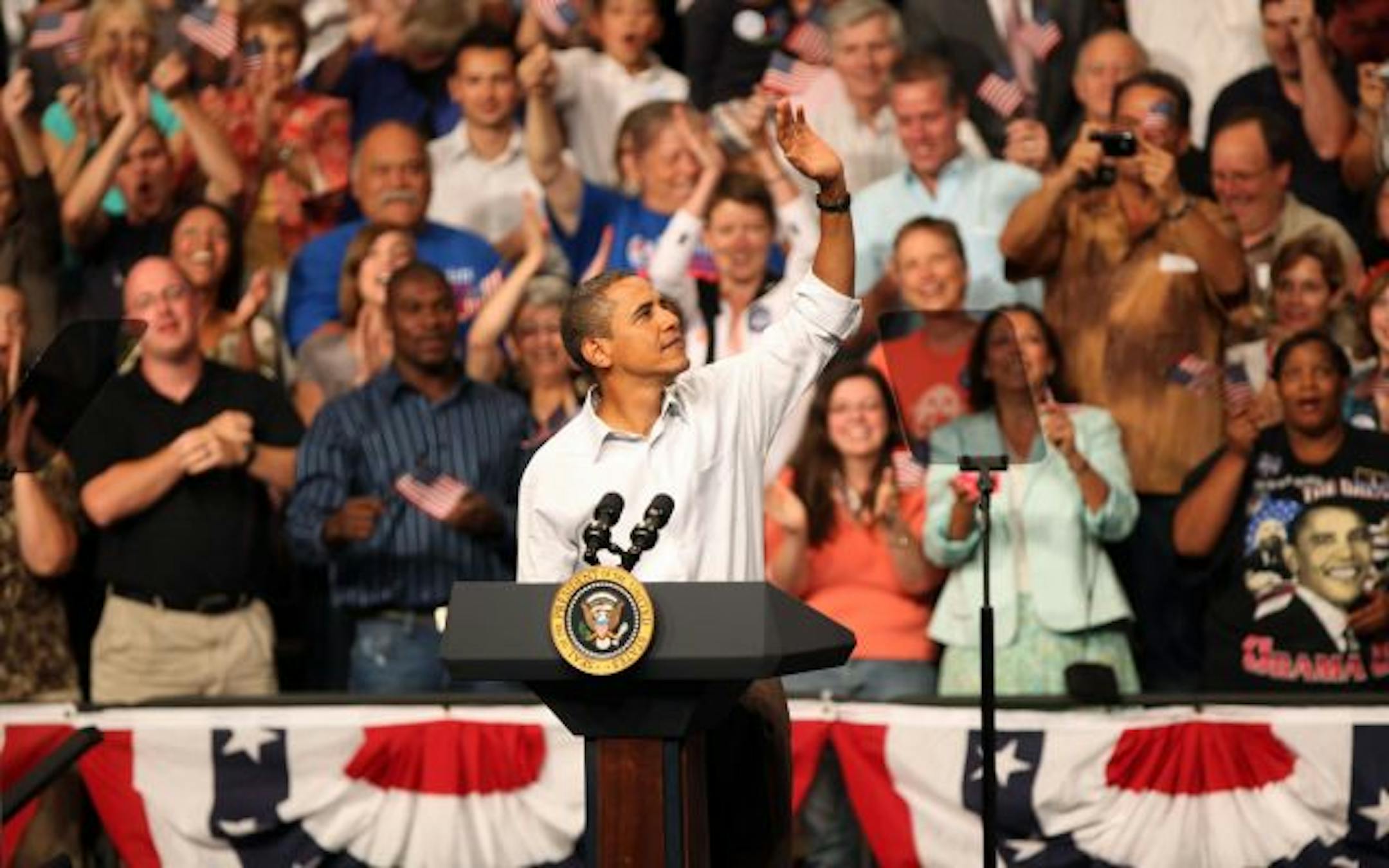 President Obama waved to the crowd as he entered the Target Center Arena.