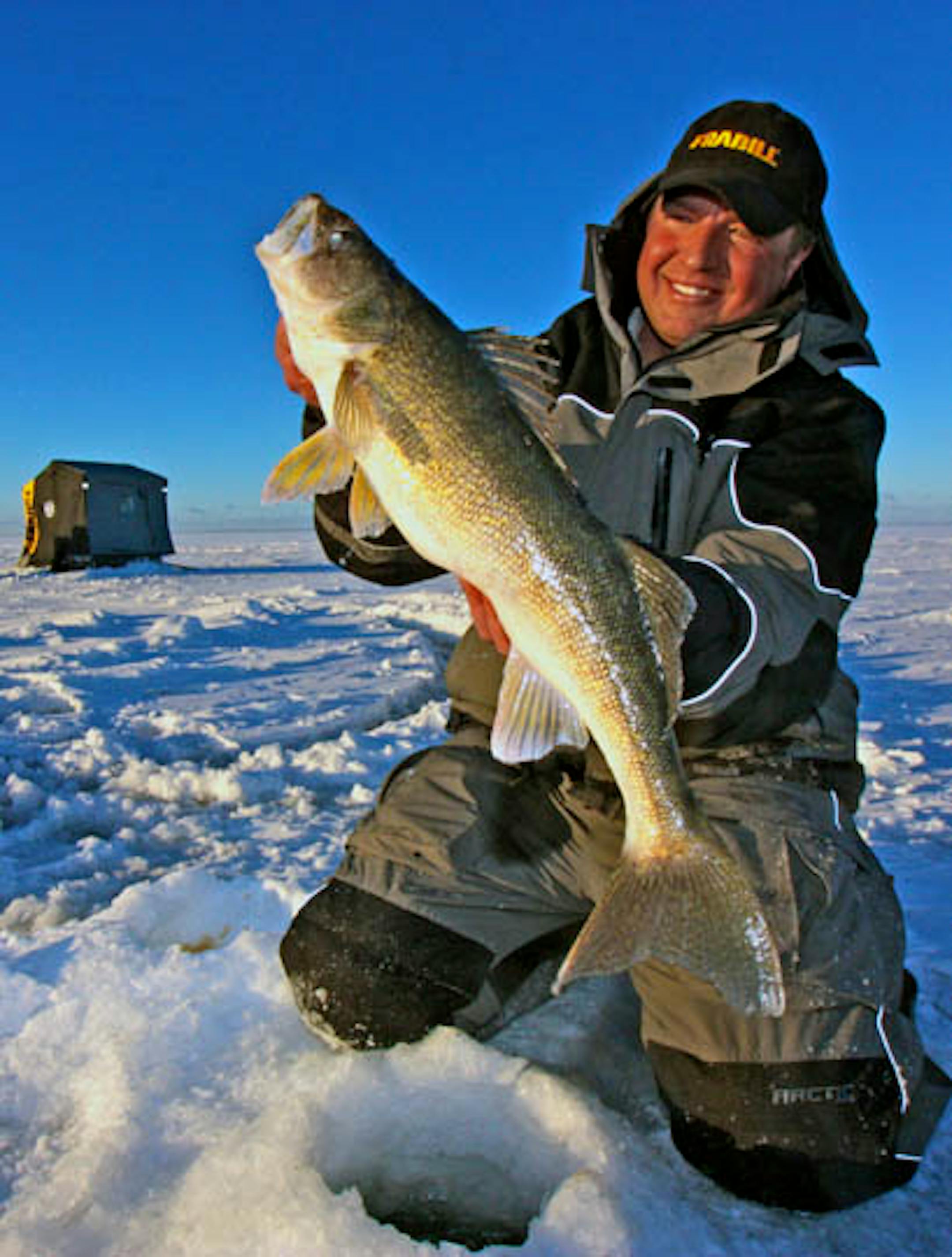 Tony Roach of Roach's Guide Service on Mille Lacs with a quality mid-winter walleye