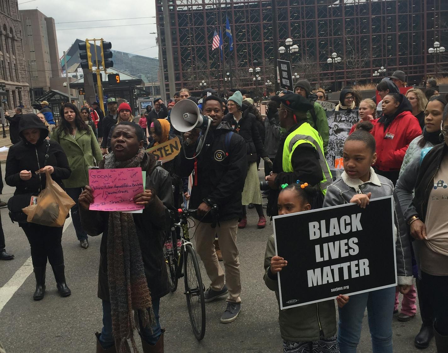 Protesters prepared to march Saturday in downtown Minneapolis after a rally over the shooting of Jamar Clark.