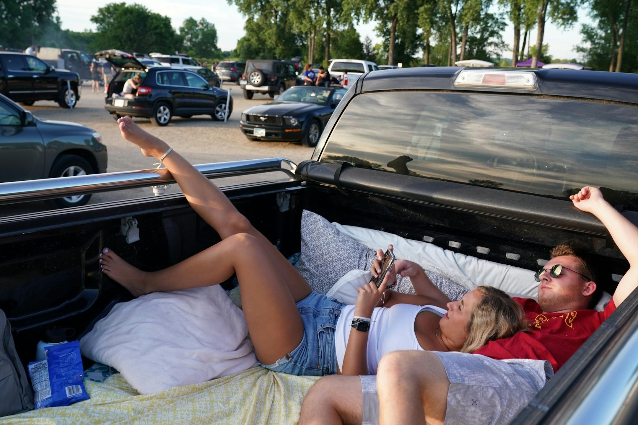 Caitlin McCarthy and Zach Parent, both 19 of Lakeville, looked on the phones among a half dozen pillows as they waited for the start of Friday night's show.