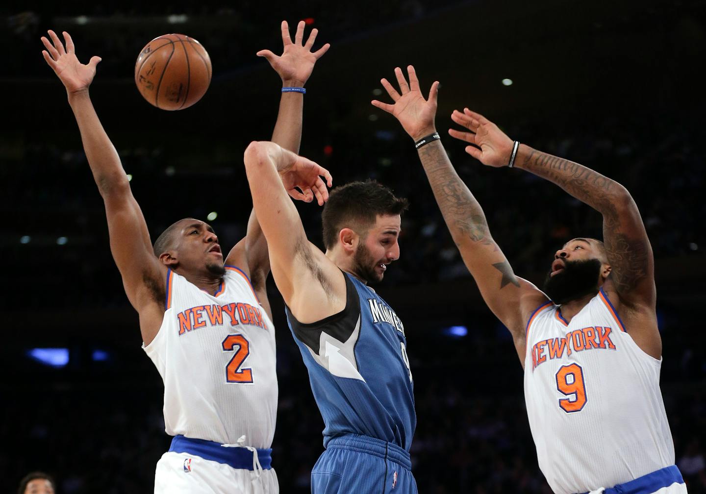 Timberwolves guard Ricky Rubio passed behind his head against Knicks guard Langston Galloway (2) and forward Kyle O'Quinn (9) during the first quarter of New York's 107-102 victory at Madison Square Garden on Wednesday.