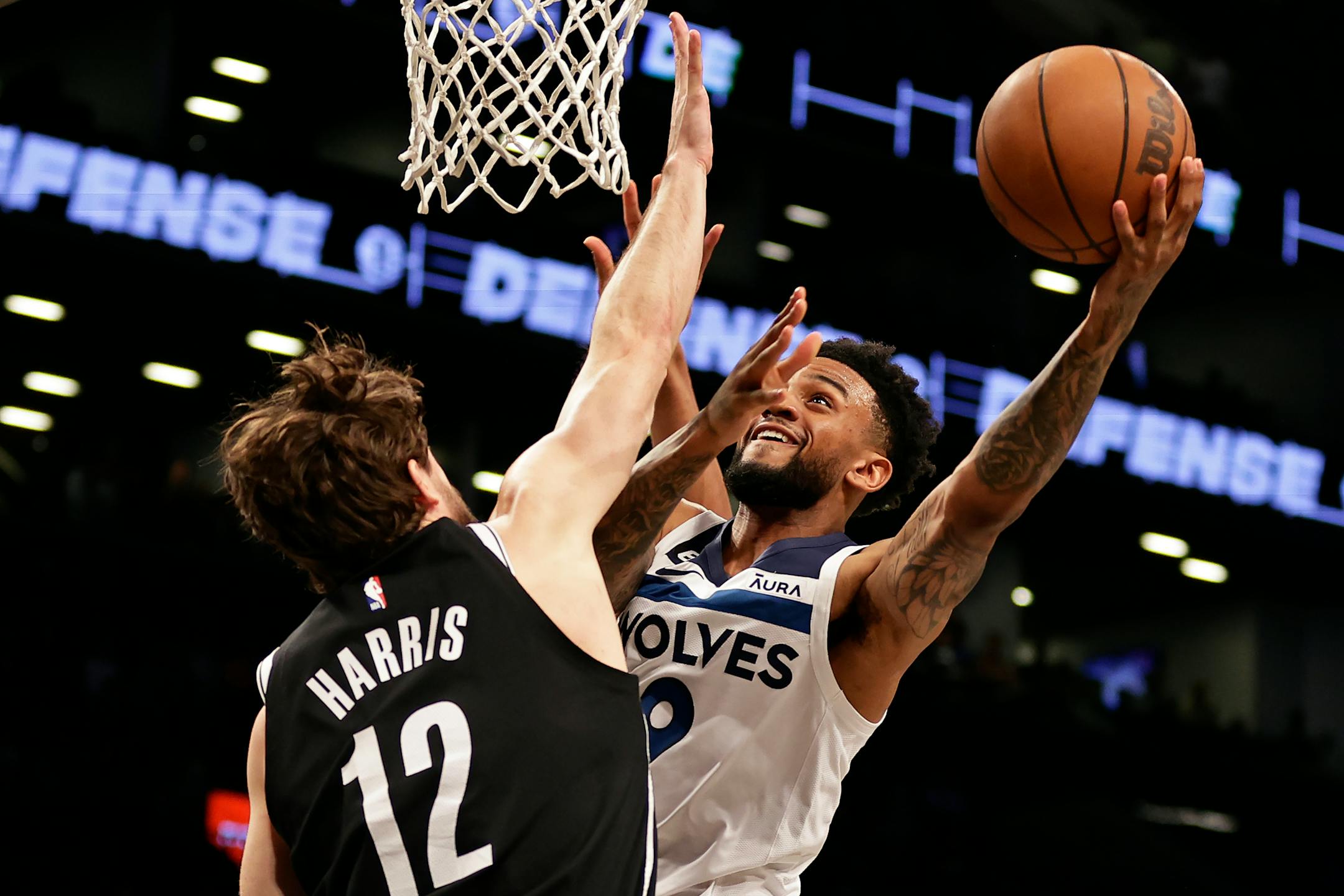 Timberwolves guard Nickeil Alexander-Walker drove to the basket against Nets forward Joe Harris during the first half Tuesday