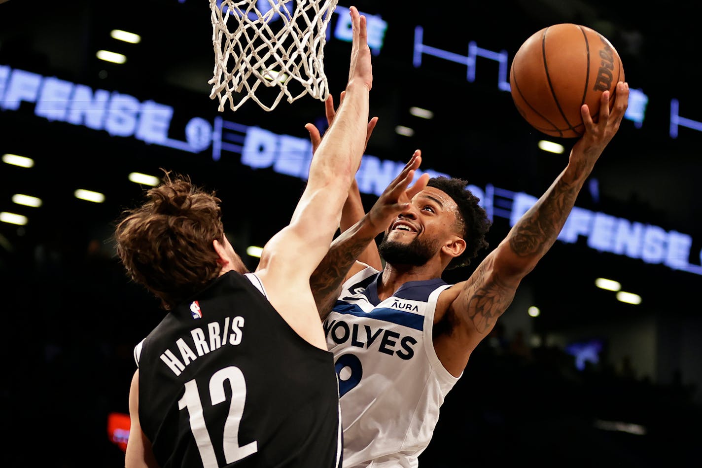 Timberwolves guard Nickeil Alexander-Walker drove to the basket against Nets forward Joe Harris during the first half Tuesday