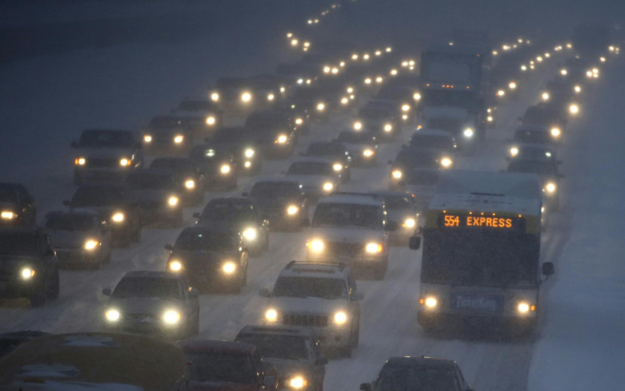 Seen from the 42nt Steet S. Bridge over I-35W bridge, traffic headed north was anything but express as a larger than predicted snowfall greeted commuters Thursday, Jan. 30, 2014, in Minneapolis, MN.](DAVID JOLES/STARTRIBUNE) djoles@startribune.com A larger than expected snowfall snarled traffic throughout the Twin Cities, more than tripling the commute time for many. ORG XMIT: MIN2014013010424508