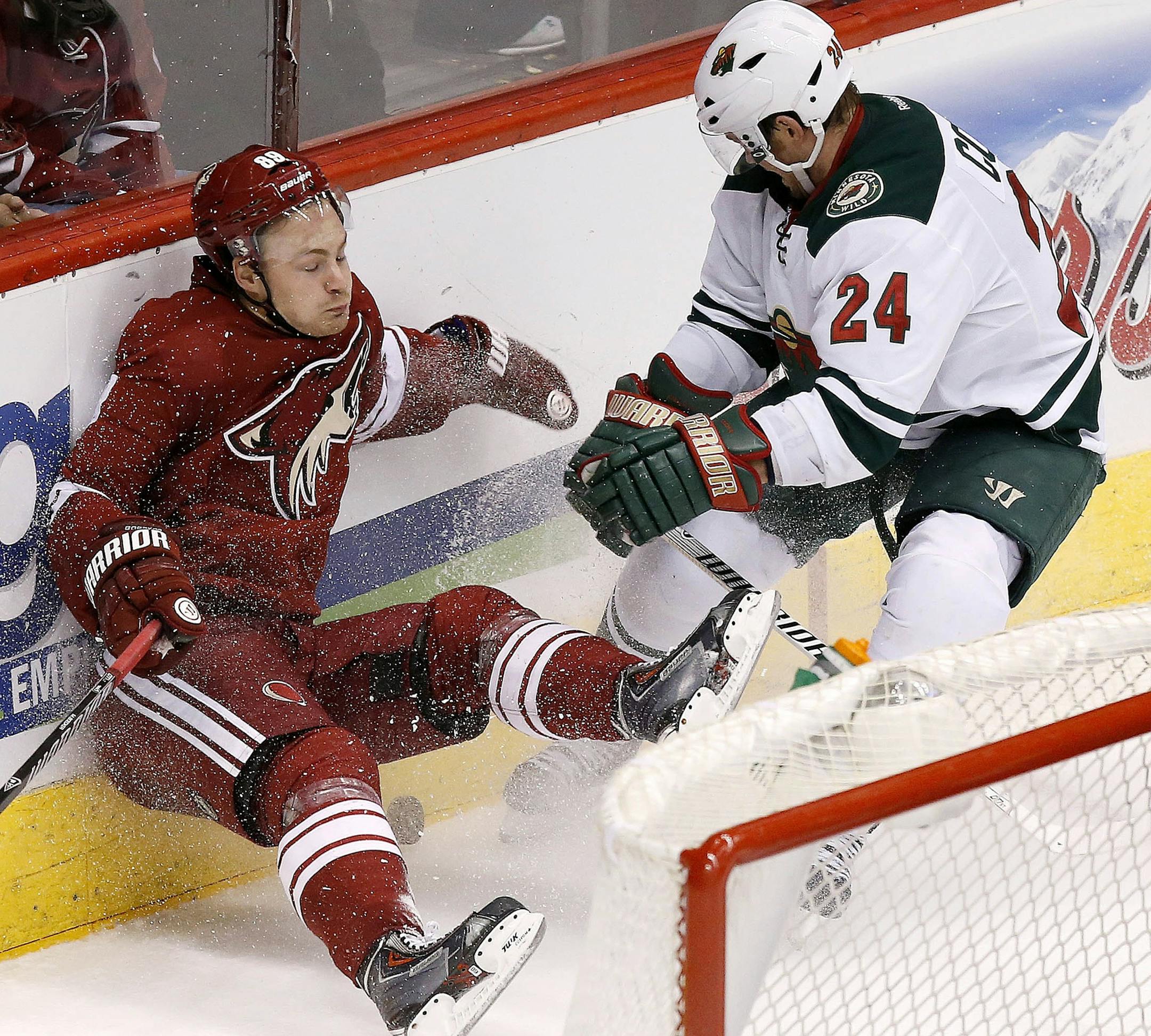 Matt Cooke's check on the Coyotes' Mikkel Boedker was an example of how seriously the Wild took its must-win game Saturday in Phoenix. The Wild hung close, then pulled away for a 3-1 victory.