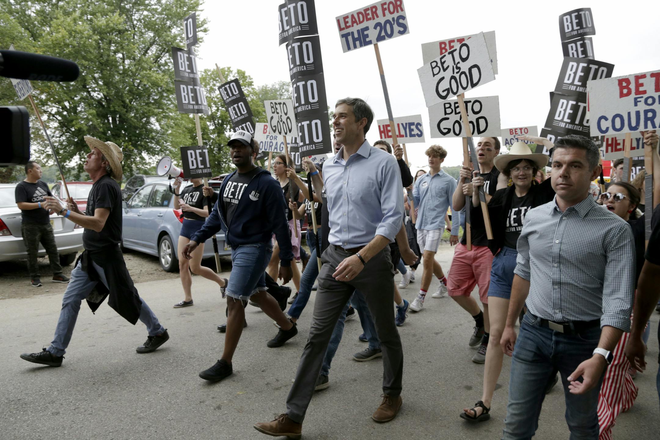 Democratic presidential candidate former Texas Rep. Beto O'Rourke marches with supporters at the Polk County Democrats Steak Fry, in Des Moines, Iowa, Saturday, Sept. 21, 2019. (AP Photo/Nati Harnik)
