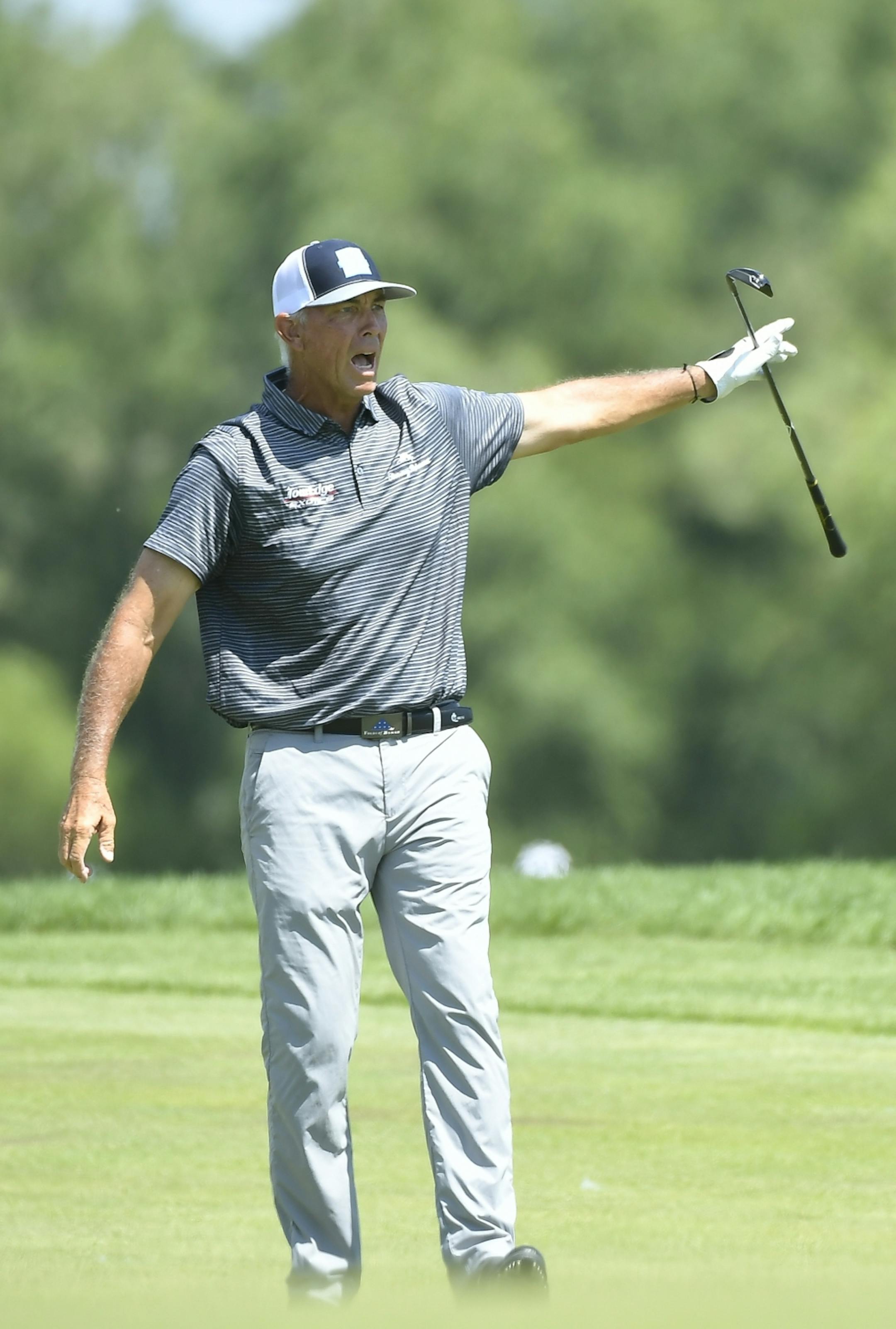 Tom Lehman yelled "fore" to fans around the 9th hole green after hitting a stray ball from the fairway Saturday.