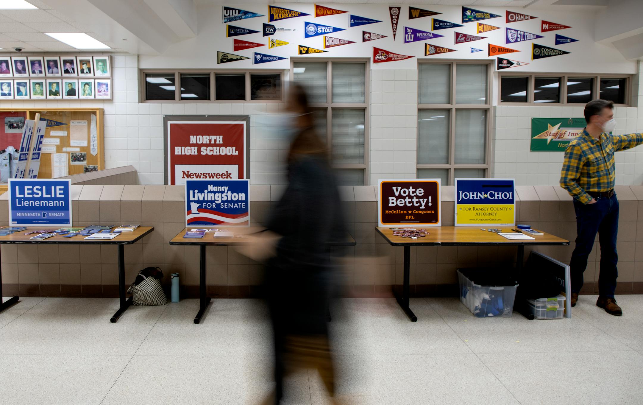 A resident walks to one of the rooms during a DFL caucus Tuesday, Feb. 1, at North High School in North Saint Paul, Minn. ] CARLOS GONZALEZ • cgonzalez@startribune.com