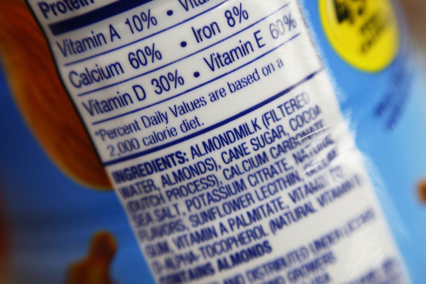 FILE - This Feb. 16, 2017, photo shows the ingredients label for almond milk at a grocery store in New York. Soy and almond drinks don't come from cows, so regulators may soon ask them to stop calling themselves "milk." The Food and Drug Administration signaled plans to start enforcing a federal standard that defines "milk" as coming from the "milking of one or more healthy cows." That would mark a change for the agency, which has not aggressively gone after the proliferation of plant-based drin