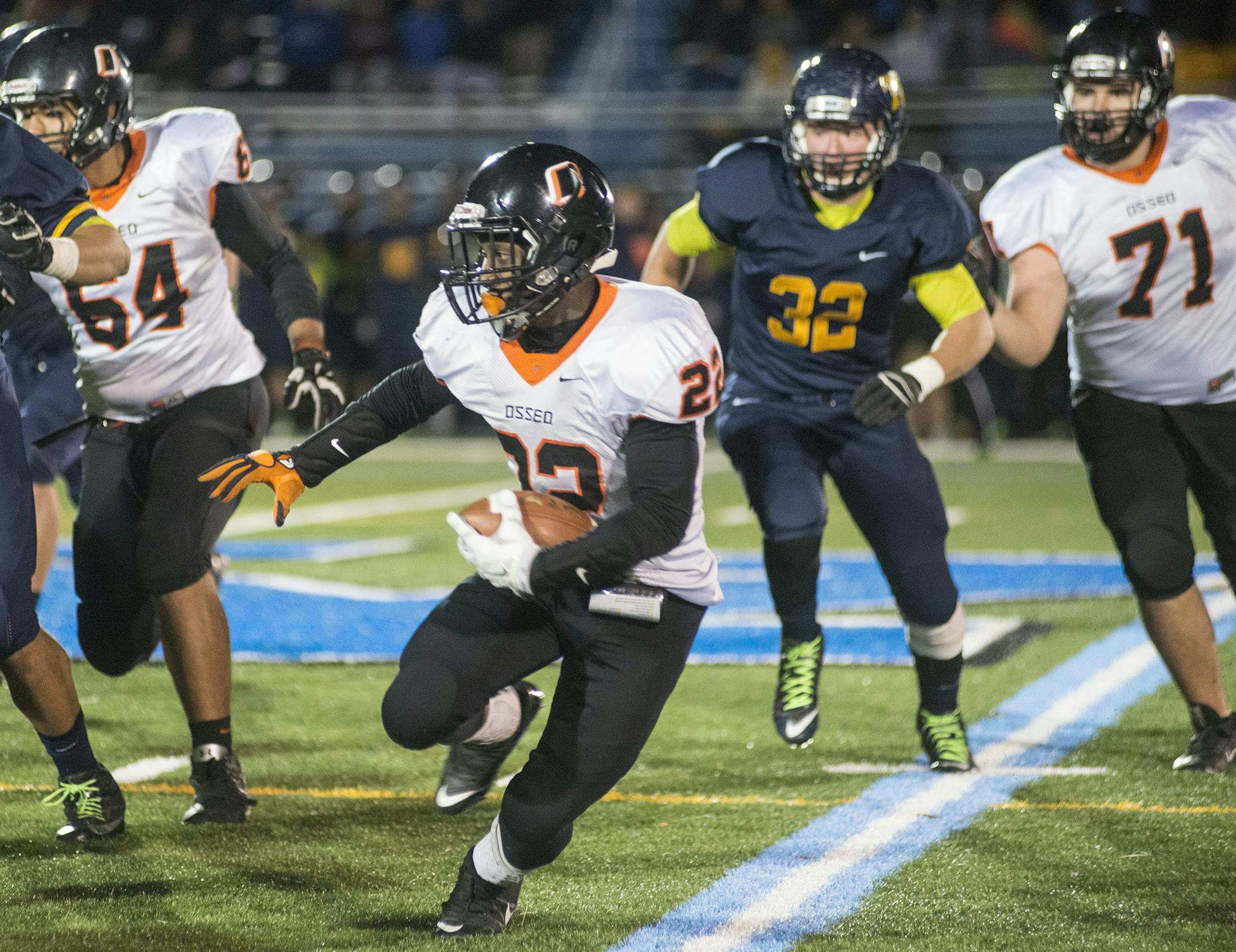 Osseo High School's Prince Kruah cuts to the outside on a run during the second quarter of the Class 6A State Semifinal Friday night at Minnetonka High School. Osseo took the win over Totino Grace 22-11. ] (Matthew Hintz, 110615, Minnetonka)