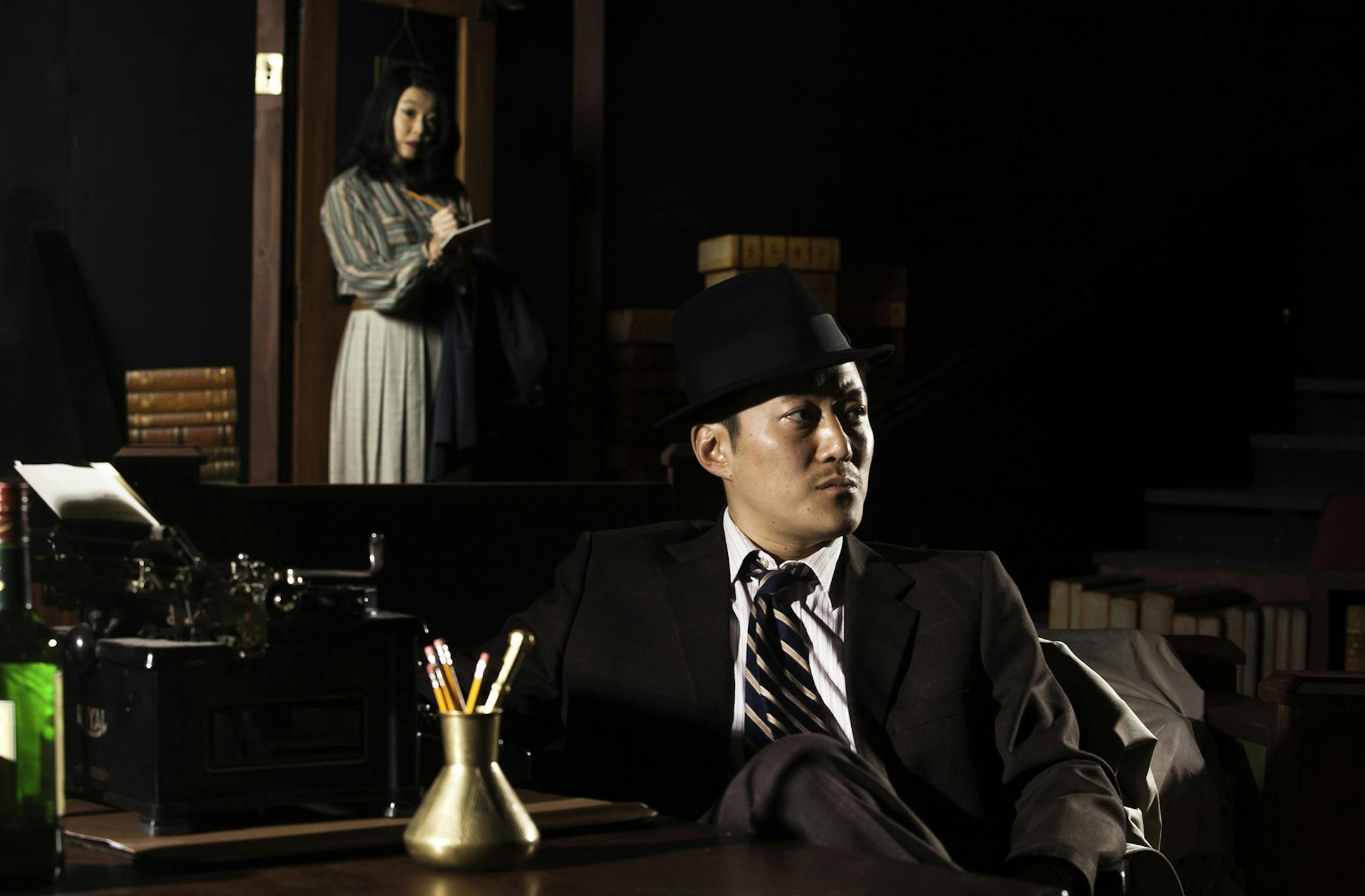Sara Ochs as reporter Nancy Wing and Kurt Kwan as private eye Sam Shikaze in Mu Performing Arts’ “Yellow Fever.” © Eric Melzer Photography, 2012