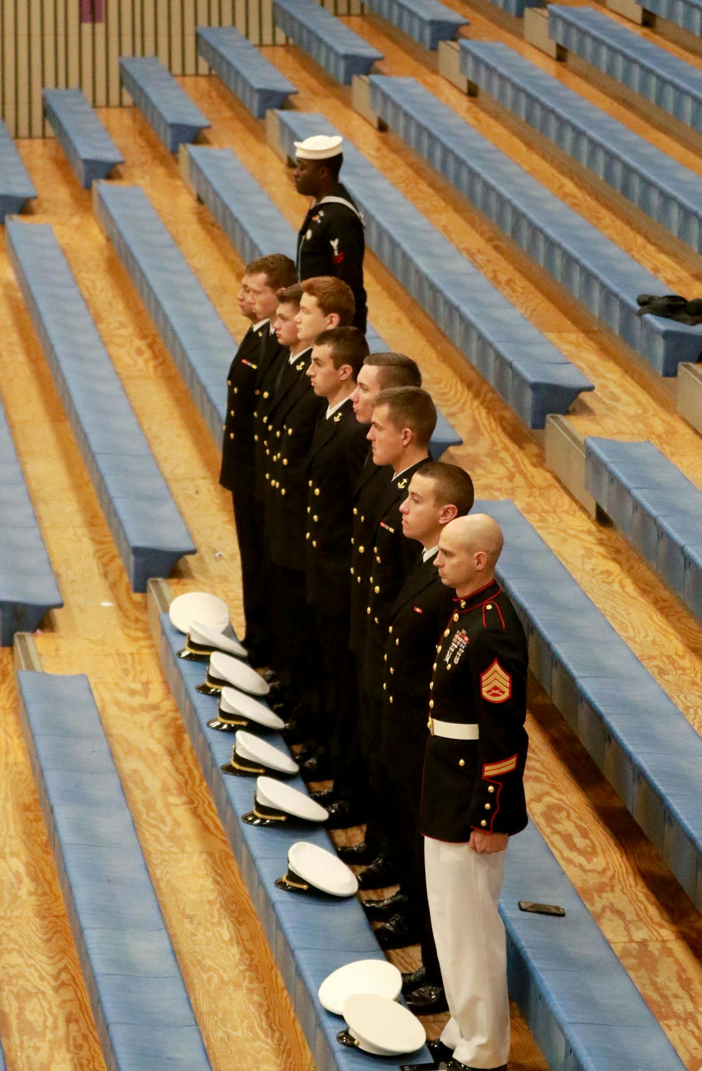 Members of the University of Minnesota Navy ROTC stand at attention as Washington Technology Magnet School Navy junior ROTC members take their spots on the gym floor Thursday, Oct. 27, 2016, at Washington in St. Paul, MN.](DAVID JOLES/STARTRIBUNE)djoles@startribune.com The St. Paul school district is considering expanding its school ROTC programs to a sixth high school -- Highland Park Senior High -- in 2017-18. On Thursday night, the school will seek input on the proposal from the community, an