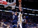 New Orleans Pelicans forward Anthony Davis (23) shoots over Minnesota Timberwolves forward Taj Gibson (67) in the second half of an NBA basketball gam