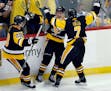 The Penguins' Jake Guentzel, center, celebrated his goal against the Nashville Predators with Ian Cole, left, and Matt Cullen during the third period 
