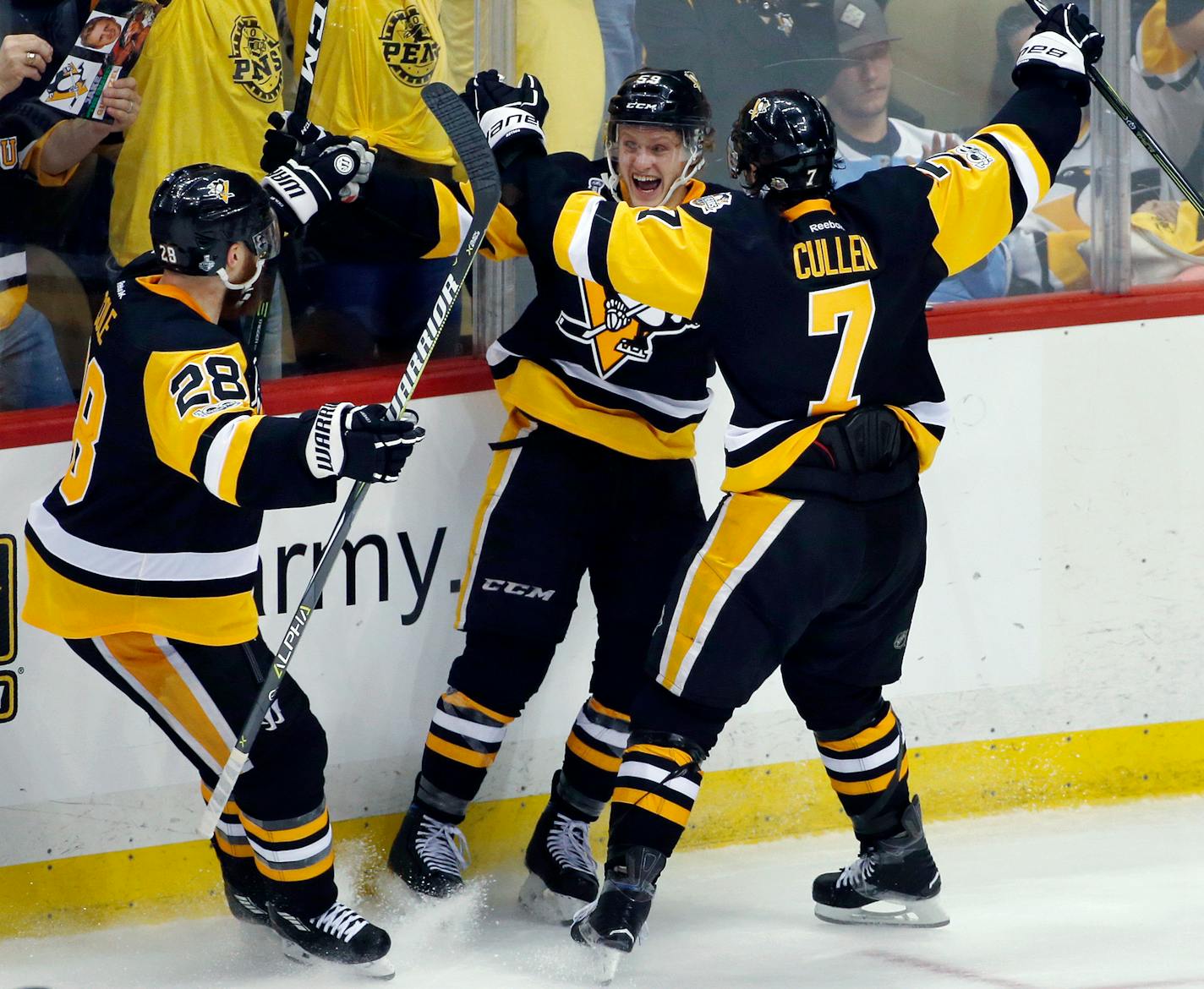 The Penguins' Jake Guentzel, center, celebrated his goal against the Nashville Predators with Ian Cole, left, and Matt Cullen during the third period in Game 1 of the Stanley Cup Final on Monday.