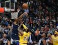Timberwolves center Karl-Anthony Towns swatted away a first-half shot by the Lakers' LeBron James at Target Center on Monday night.