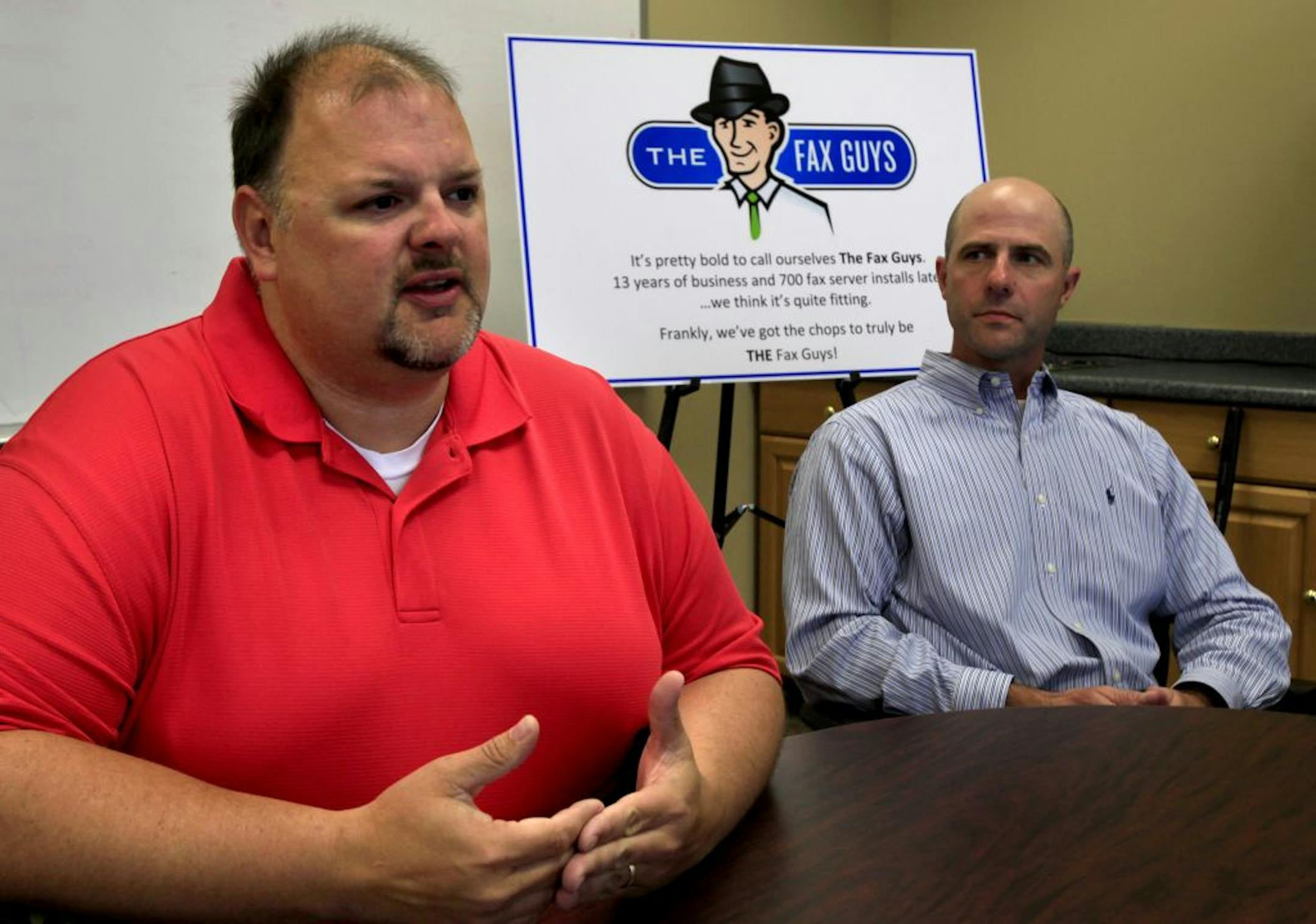 Greg Osterdyk (left) and Brent Lothrop of The Fax Guys on May 24, 2012 in their Burnsville office at 11975 Portland Avenue, Suite 110.