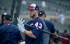 Minnesota Twins catcher Mitch Garver (43) adjusted his gloves during batting practice Friday.