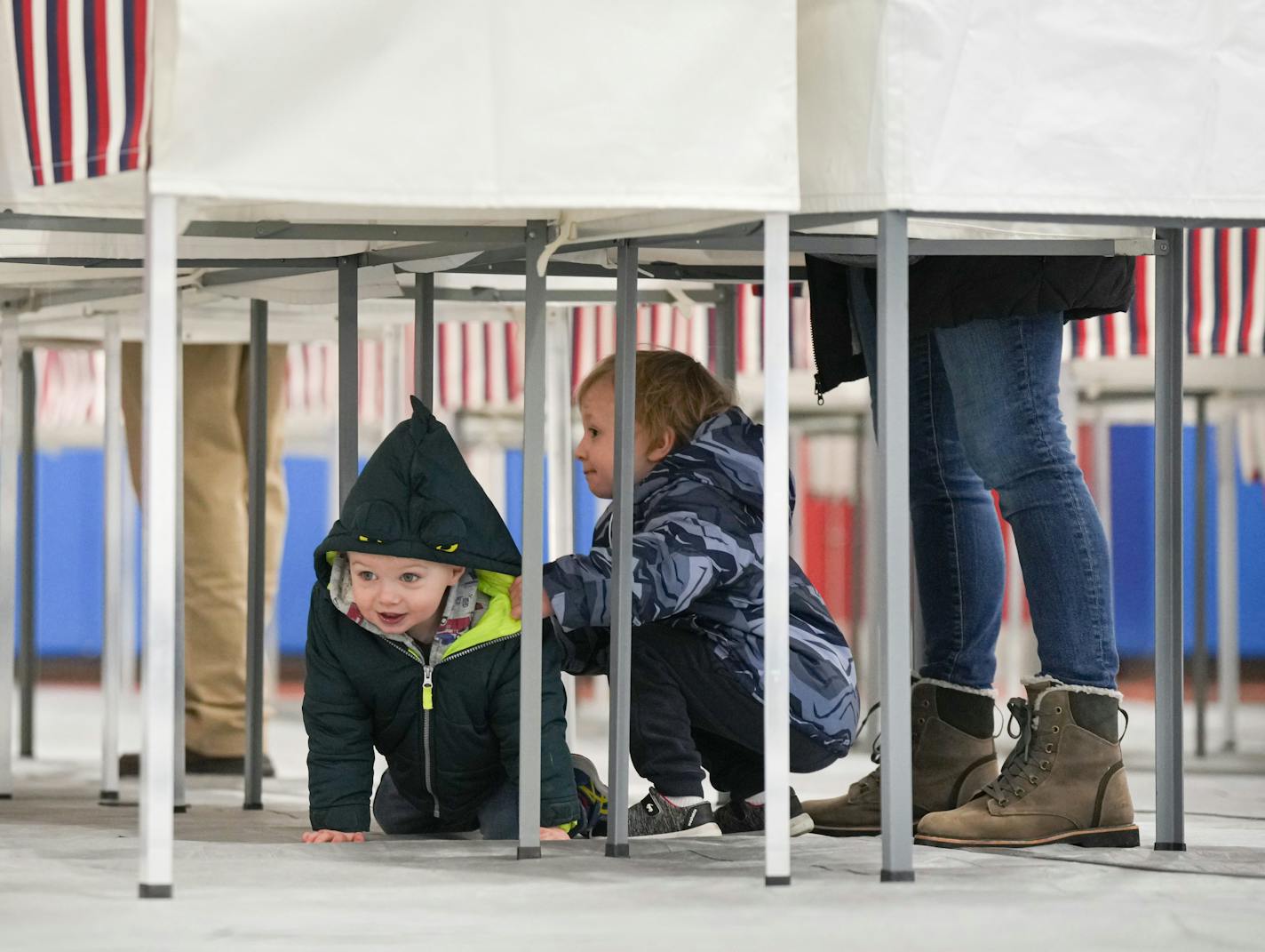 Cooper Stinson, 3, center, kept an eye on his younger brother Coen, 2, as their mom Kelly Stinson voted in the New Hampshire primary.  Dean  Phillips spent election day greeting voters and volunteers for other candidates outside polls in the southern New Hampshire area. At 8:20 AM he visited Londonderry High School, 295 Mammoth Road, Londonderry Tuesday, Jan. 23, 2024  Londonderry, New Hampshire   ] GLEN STUBBE • glen.stubbe@startribune.com