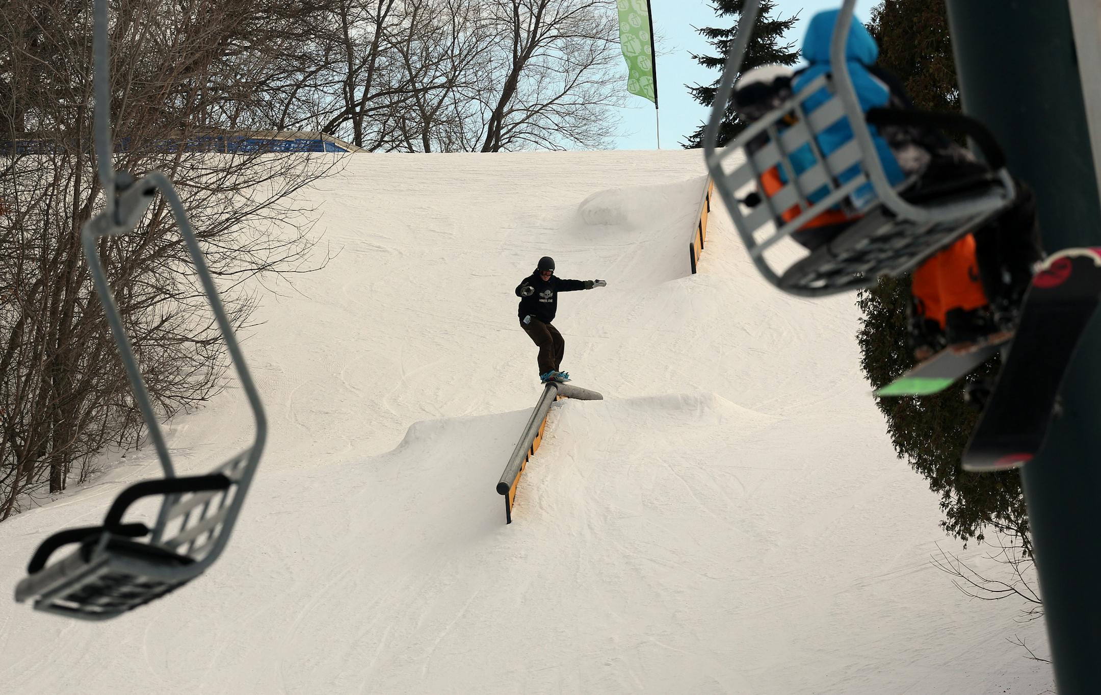 Snowboarders used the jumps and the rails on a warm day at Buck Hill. ] (KYNDELL HARKNESS/STAR TRIBUNE) kyndell.harkness@startribune.com At Buck Hill ski resort in Burnsville, MN Saturday, March 08, 2014.