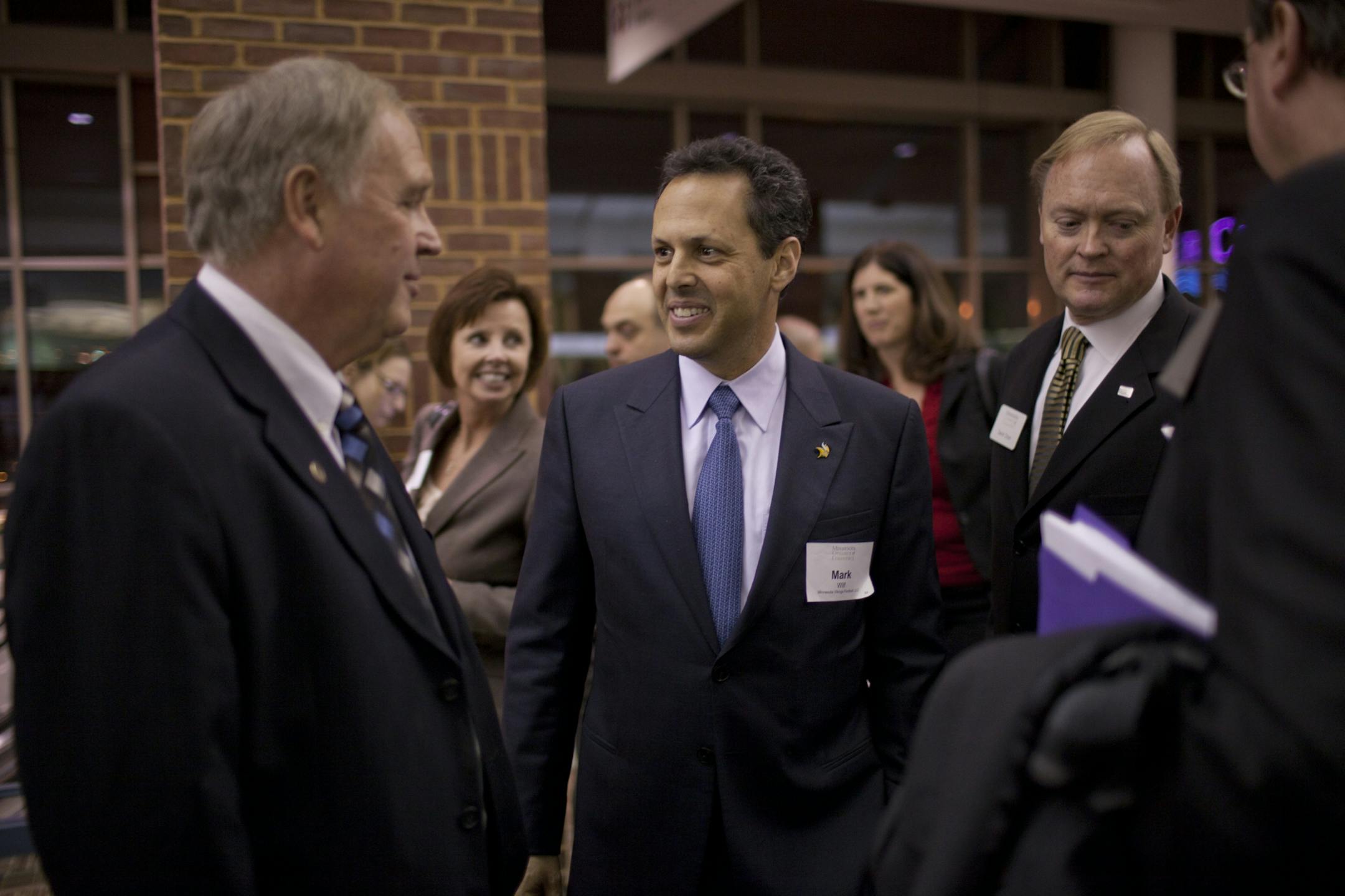 Vikings owner/president Mark Wilf (center)
