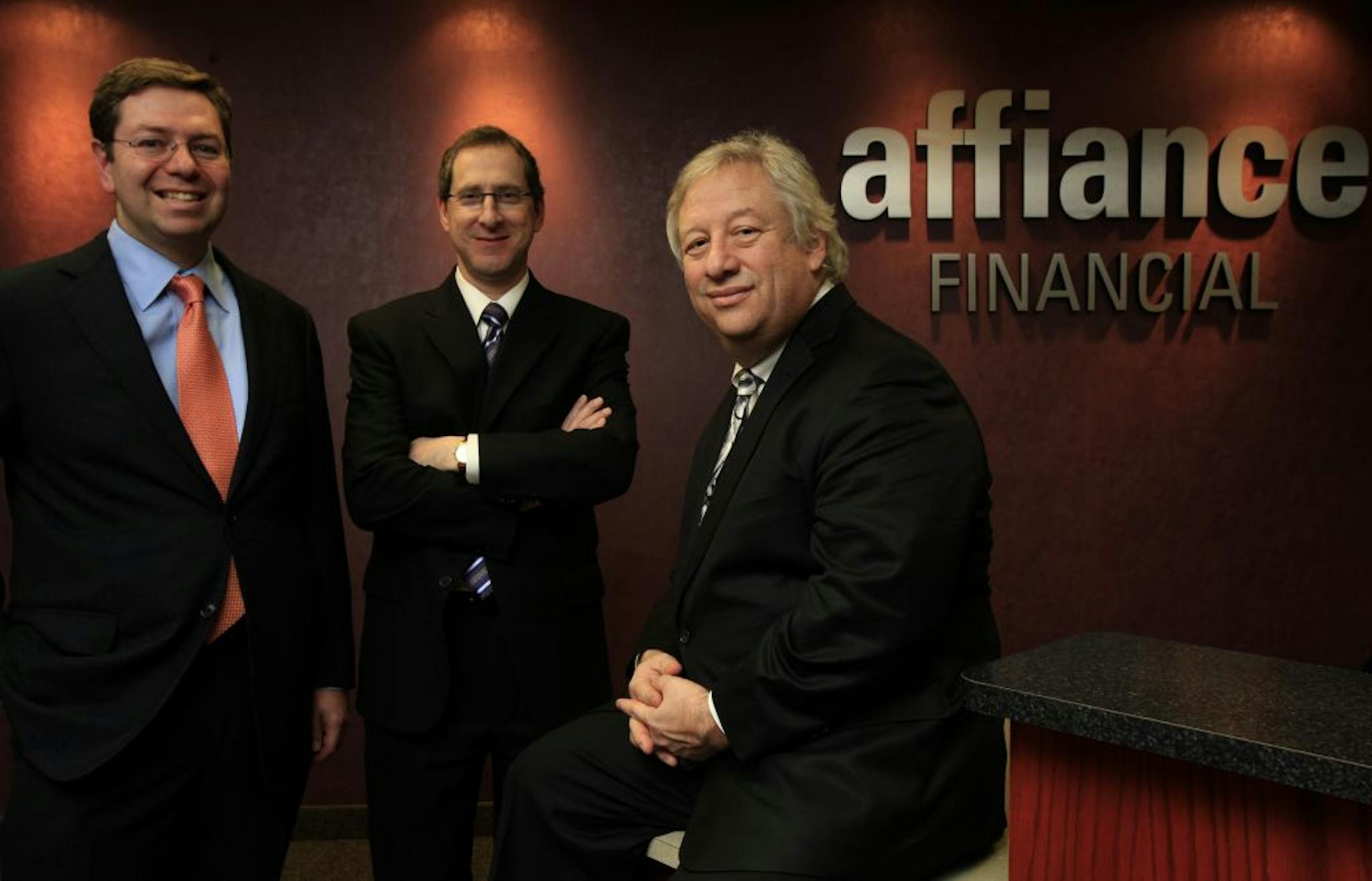 Left to Right: Seth Meisler, CPA, CPA/PFS, Director of Investments, Co-director of Operations, Andrew Fishman, CFP, Financial Advisor and Steven Lear, ChFC, Clu Financial Advisor of Affiance Financial in their St. Louis Park office. St. Louis Park, MN on December 12, 2012.