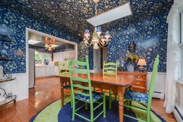 The home is decorated in a rainbow of bright floral wallpaper.