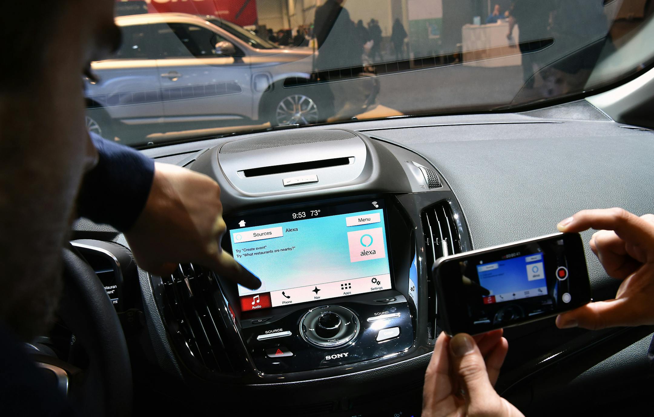 In an undated handout photo, people test Ford’s Alexa system at the International Consumer Electronics Show in Las Vegas. Ford demonstrated its its Sync 3 entertainment and navigation system, which brings the industry's first in-car Alexa integration. (Sam VarnHagen via The New York Times) — NO SALES; FOR EDITORIAL USE ONLY WITH AUTOS-VOICE-CONTROL BY NEAL BOUDETTE AND NICK WINGFIELD FOR JAN. 6,2017. ALL OTHER USE PROHIBITED. --