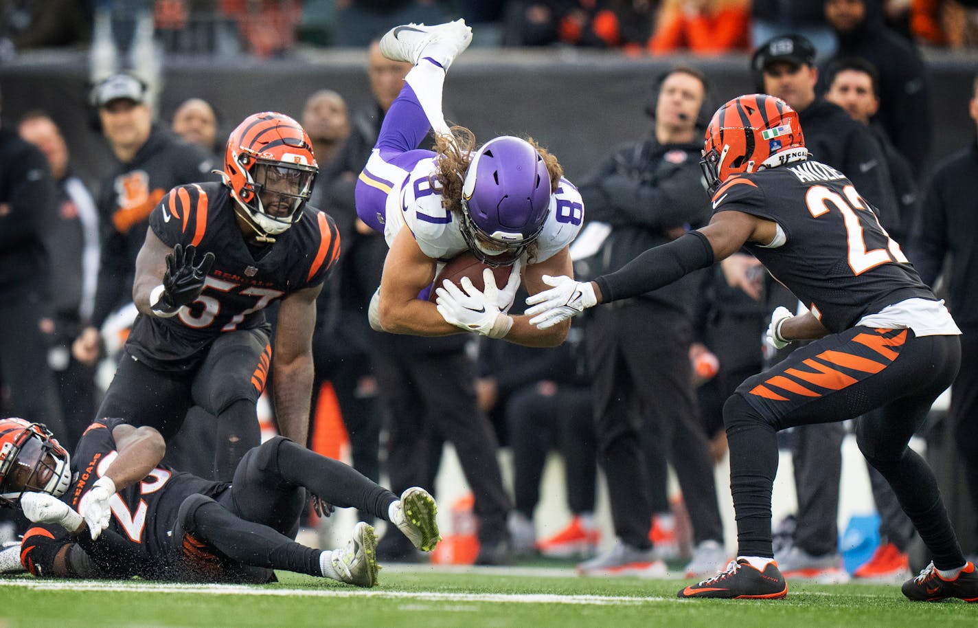 Minnesota Vikings tight end T.J. Hockenson (87) went airborne picking up a first down over Cincinnati Bengals safety Dax Hill (23) in the fourth quarter Saturday December ,16 ,2023 in,Cincinnati, OH. ] JERRY HOLT • jerry.holt@startribune.com