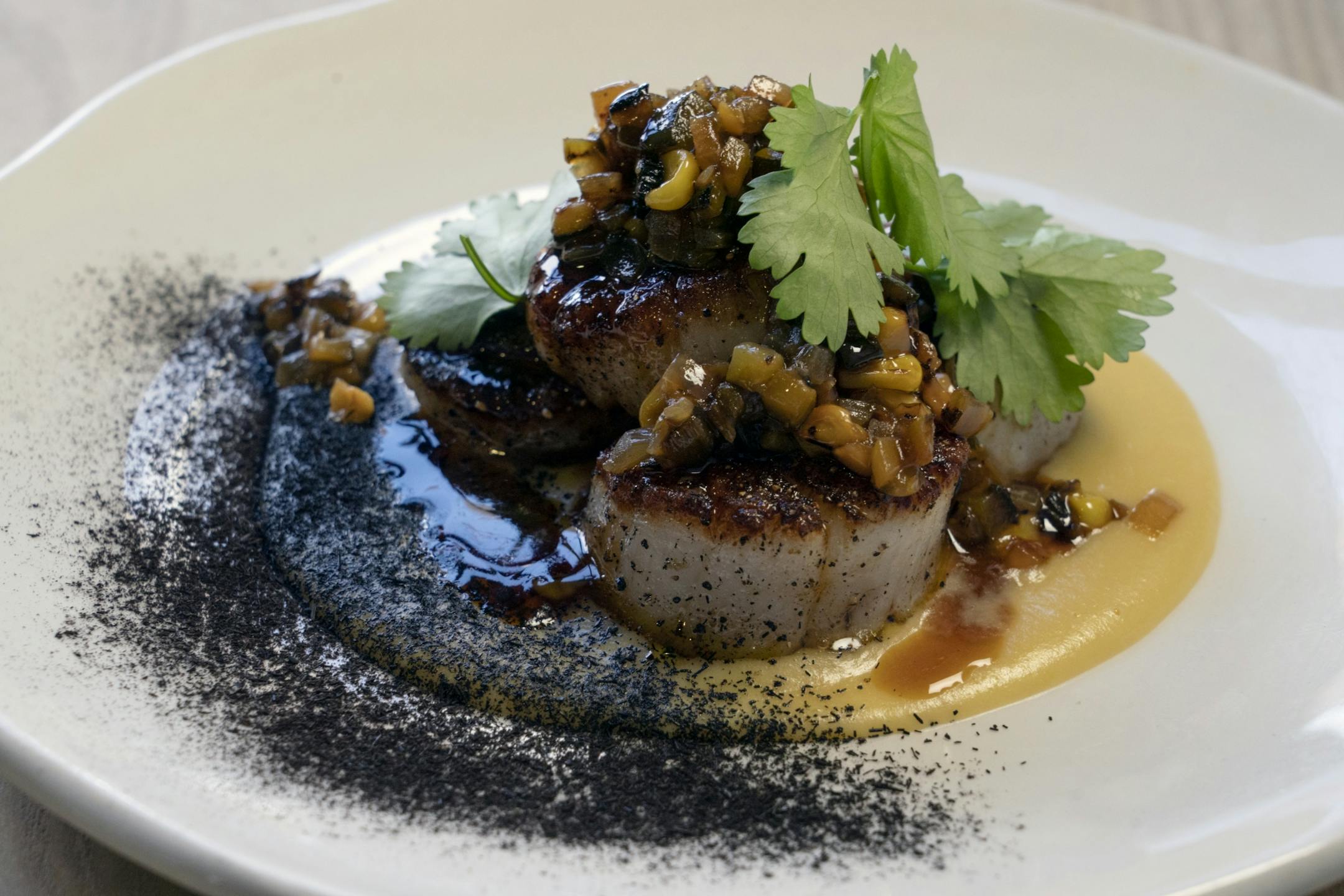 Seared Scallops corn puree, corn salsa, tamarind, burnt husk.