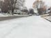 A residential road partially covered in frozen snow in South St. Paul on Sunday.