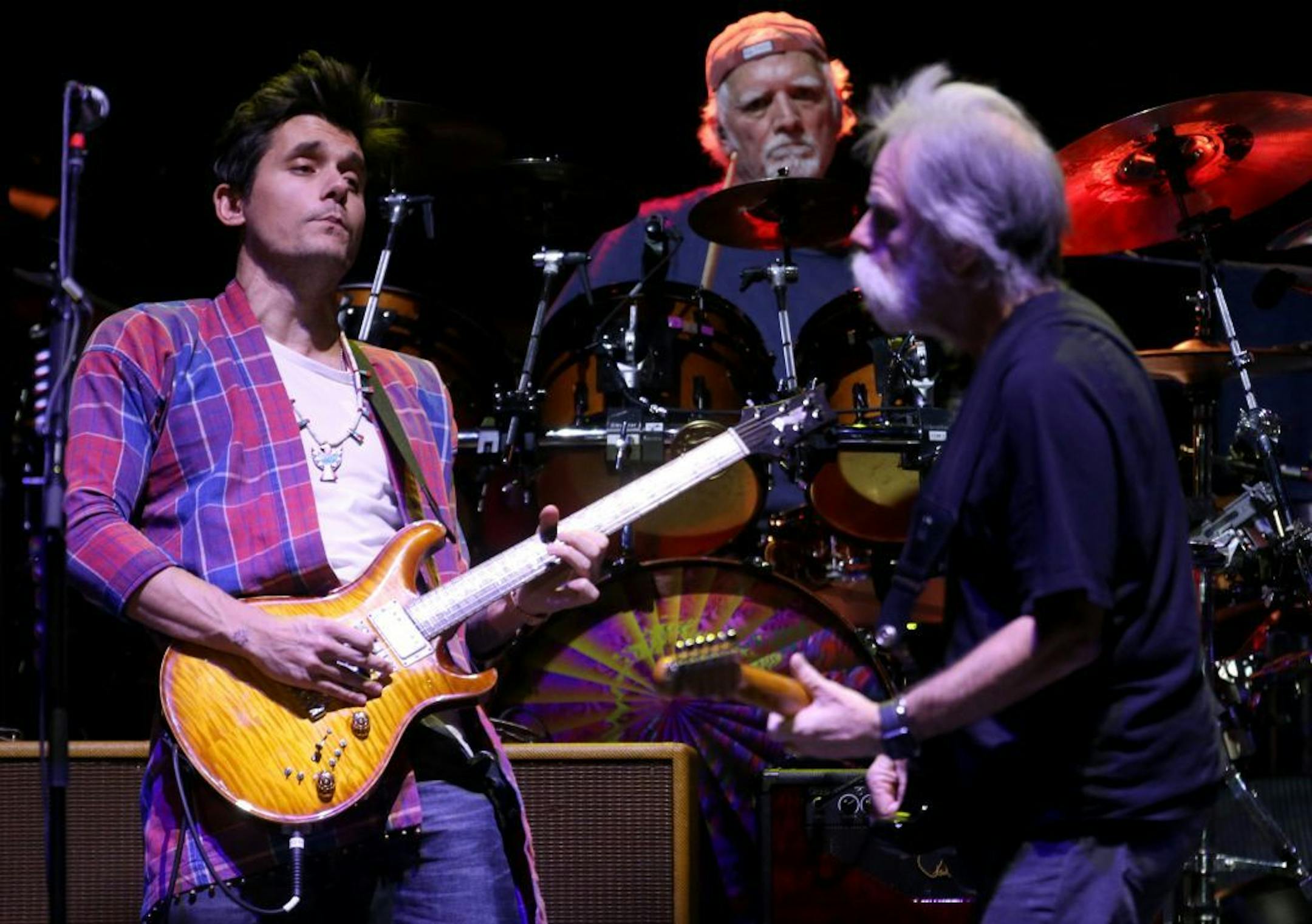 John Mayer, left, brought energy to Dead and Company, with Bob Weir, right, and drummer Bill Kreutzmann at Target Center on Saturday night.