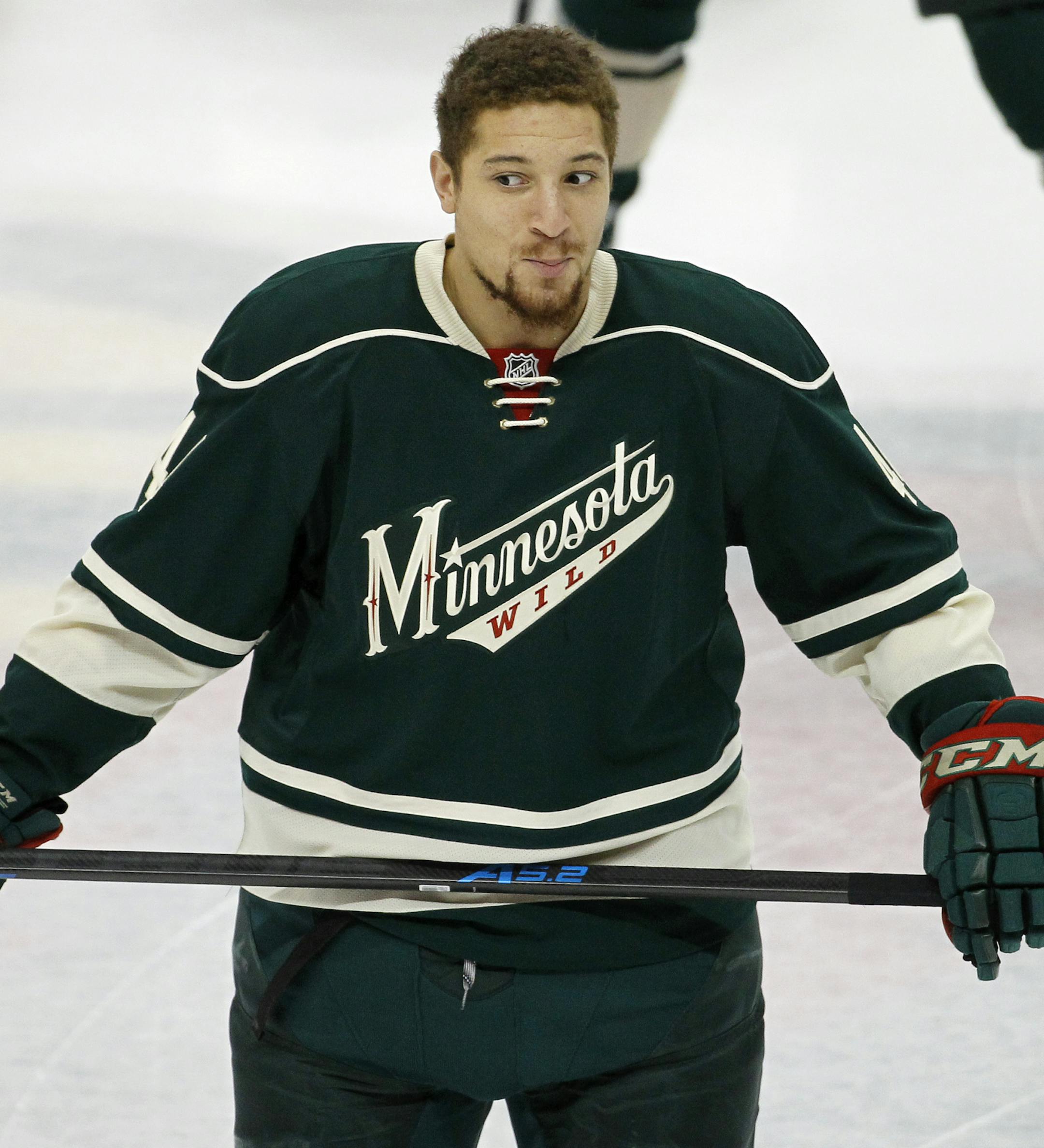 Minnesota Wild right wing Chris Stewart makes a face at a teammate before an NHL hockey game against the Detroit Red Wings in St. Paul, Minn., Saturday, April 4, 2015. (AP Photo/Ann Heisenfelt) ORG XMIT: MIN2015041621122352
