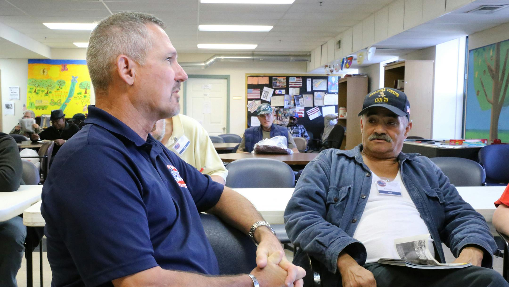 Tim Williams discusses time served in the military with Guy. G Leadum on Oct. 6, 2016 at the Veterans Multi-Services Center in Philadelphia. (Toni Farina/Philadelphia Inquirer/TNS)