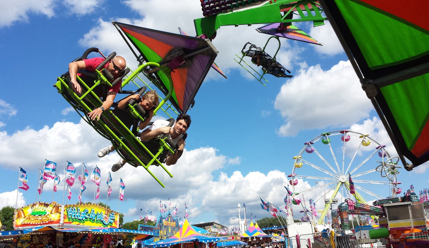 Anyone can be a kid at the fair. Moira Cross of Minneapolis took this in 2014 of (from left) Travis Tanberg, Adrian Tanberg and her son, Patrick Cross. [focus090416