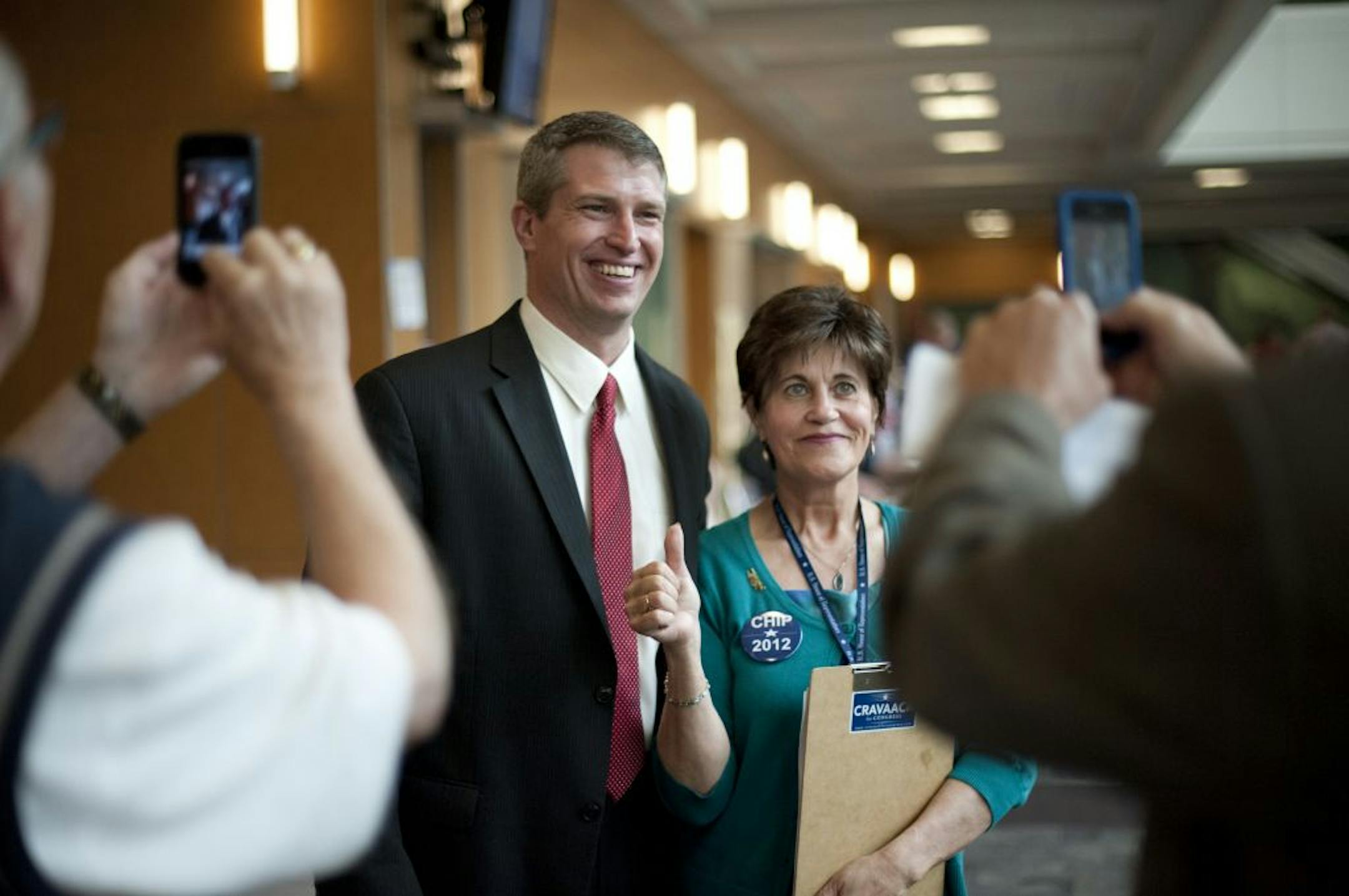 Endorsed GOP candidate for U.S. Senate Kurt Bills posed for a picture with a Chip Cravaack supporter who did not want to be named outside the convention hall. Saturday, May 19, 2012