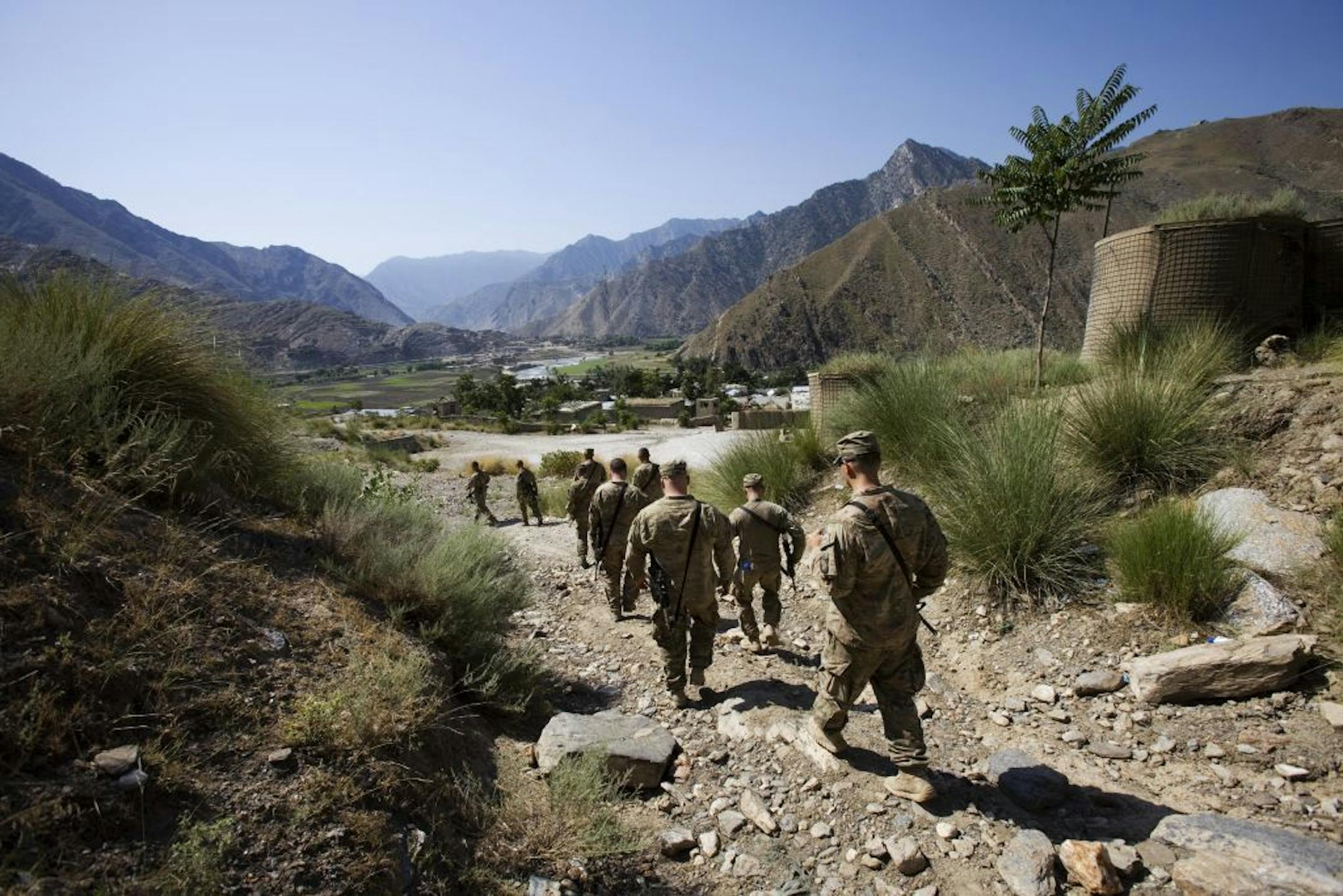 Soldiers from the 1st Battalion of the 327th Infantry Regiment, 101st Airborne Division explore the former Forward Operating Base Blessing, which is now an Afghan National Army base, at Nangalam in the Pech Valley of Afghanistan, July 5, 2013. It is uncertain how Afghan forces have made some gains that eluded American forces for so many years in the Pech Valley, but it's an example of what Afghan-led security might look like in some places after the international military coalition is gone next