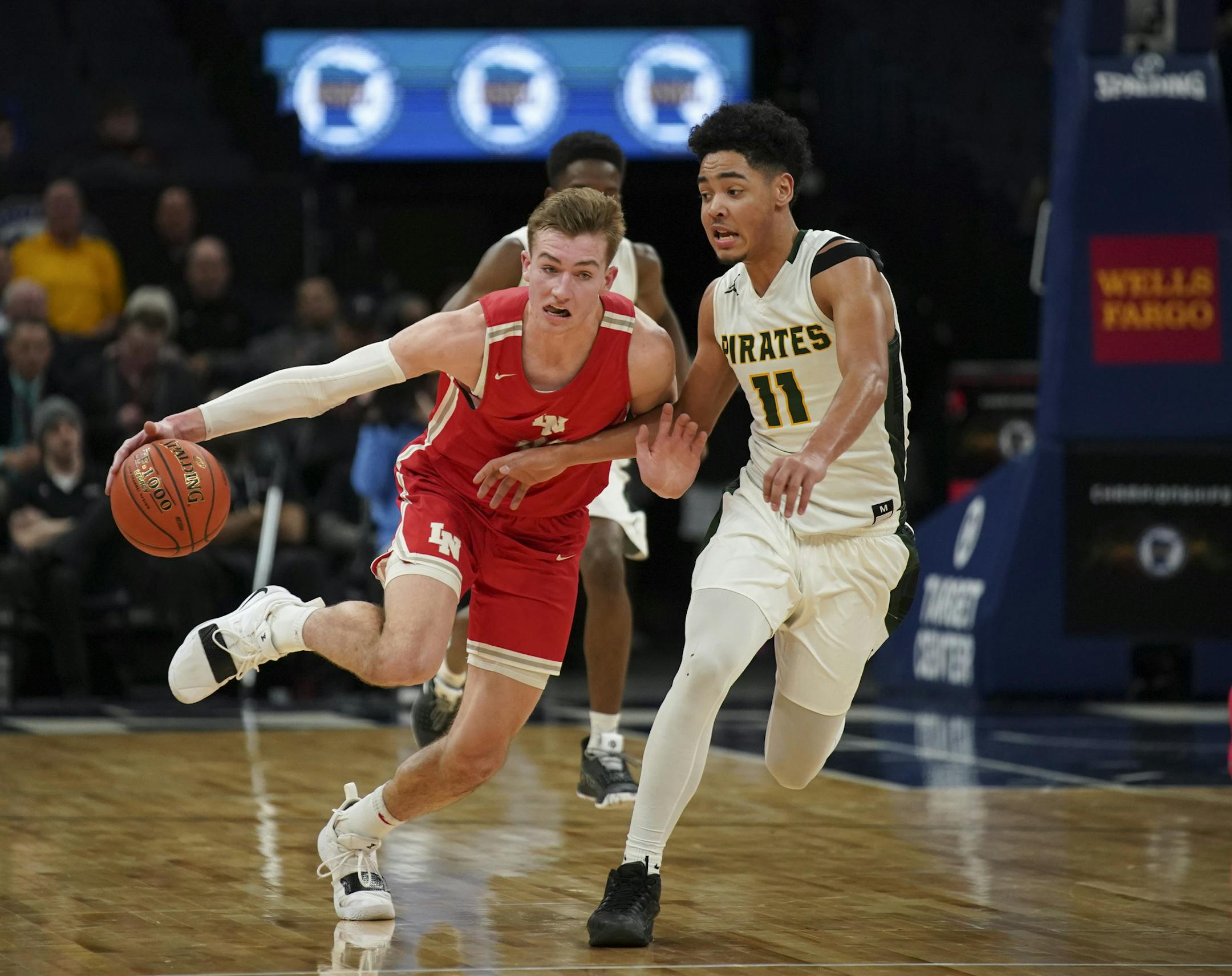 Lakeville North guard Tyler Wahl drove against Park Center guard Tommy Chatman. (Jeff Wheeler, Star Tribune)