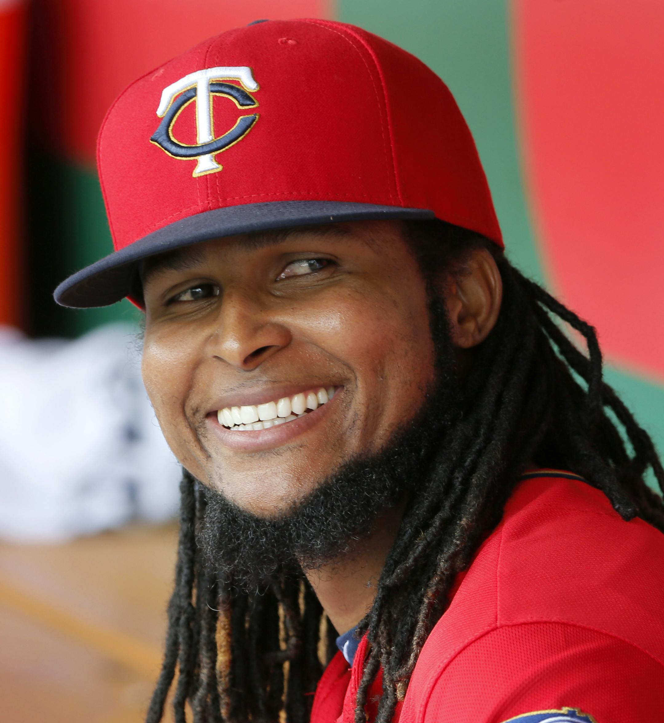 Minnesota Twins' Ervin Santana smiles as he talks with teammates in the dugout in the third inning of a spring training baseball game against the Toronto Blue Jays on Wednesday, March 30, 2016, in Fort Myers, Fla. (AP Photo/Tony Gutierrez)