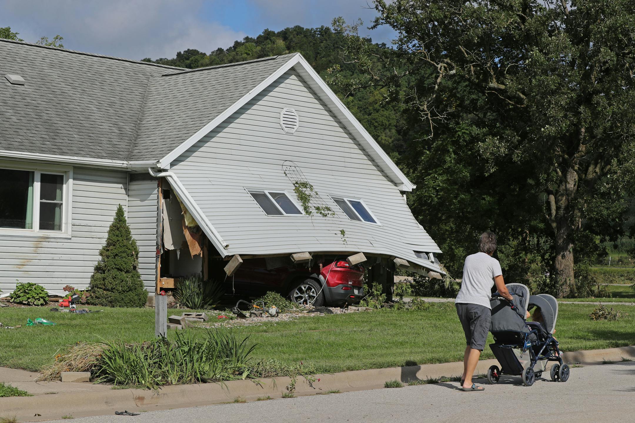 A home on Old Mill Road in Coon Valley was damaged when Coon Creek flooded and roared through the town. ] Shari L. Gross ï shari.gross@startribune.com Tucker Gretebeck estimates a 10-foot wall of water blew past a dam and flooded the valley where the Tucker and Becky's Pumpkin Patch resided since 2000 near Cashton, Wisconsin. Gretebeck and his land was photographed the day after the devastation on Tuesday, August 28, 2018.