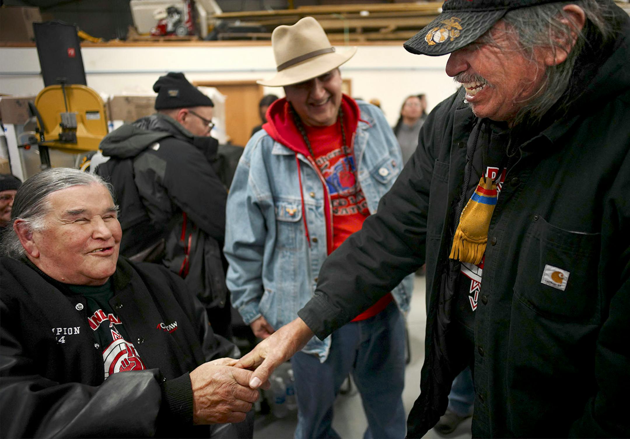 Clyde Bellecourt, one of the founding members of the American Indian Movement, greeted veterans, including Ronald Long of Red Lake, after an orientation at Sitting Bull College in Fort Yates, N.D., where veterans arrived at Standing Rock Reservation.