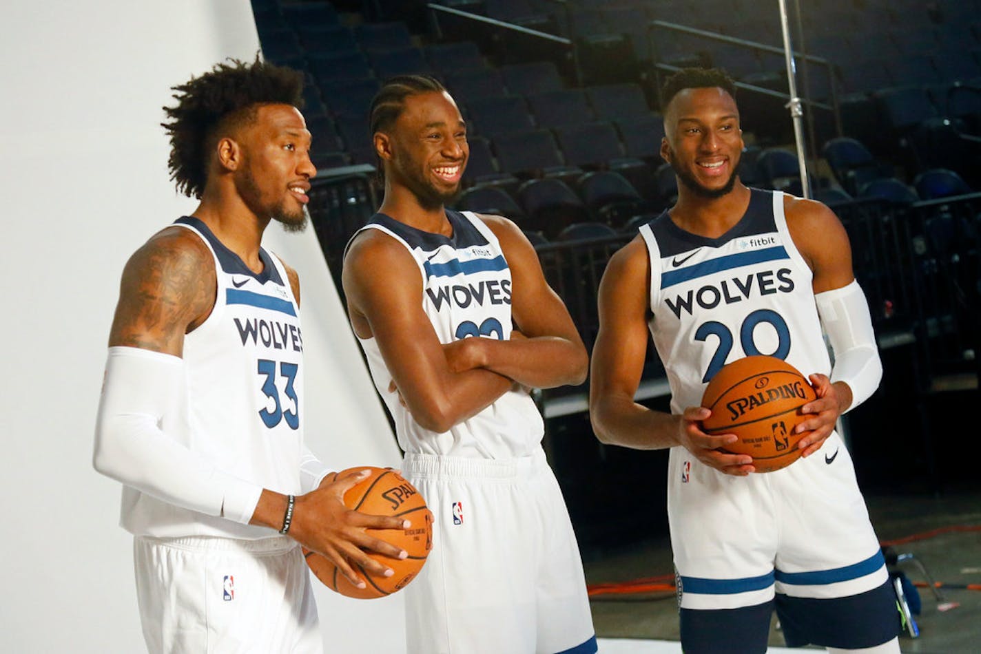 Robert Covington, left, Andrew Wiggins, center and Josh Okogie posed during media day.