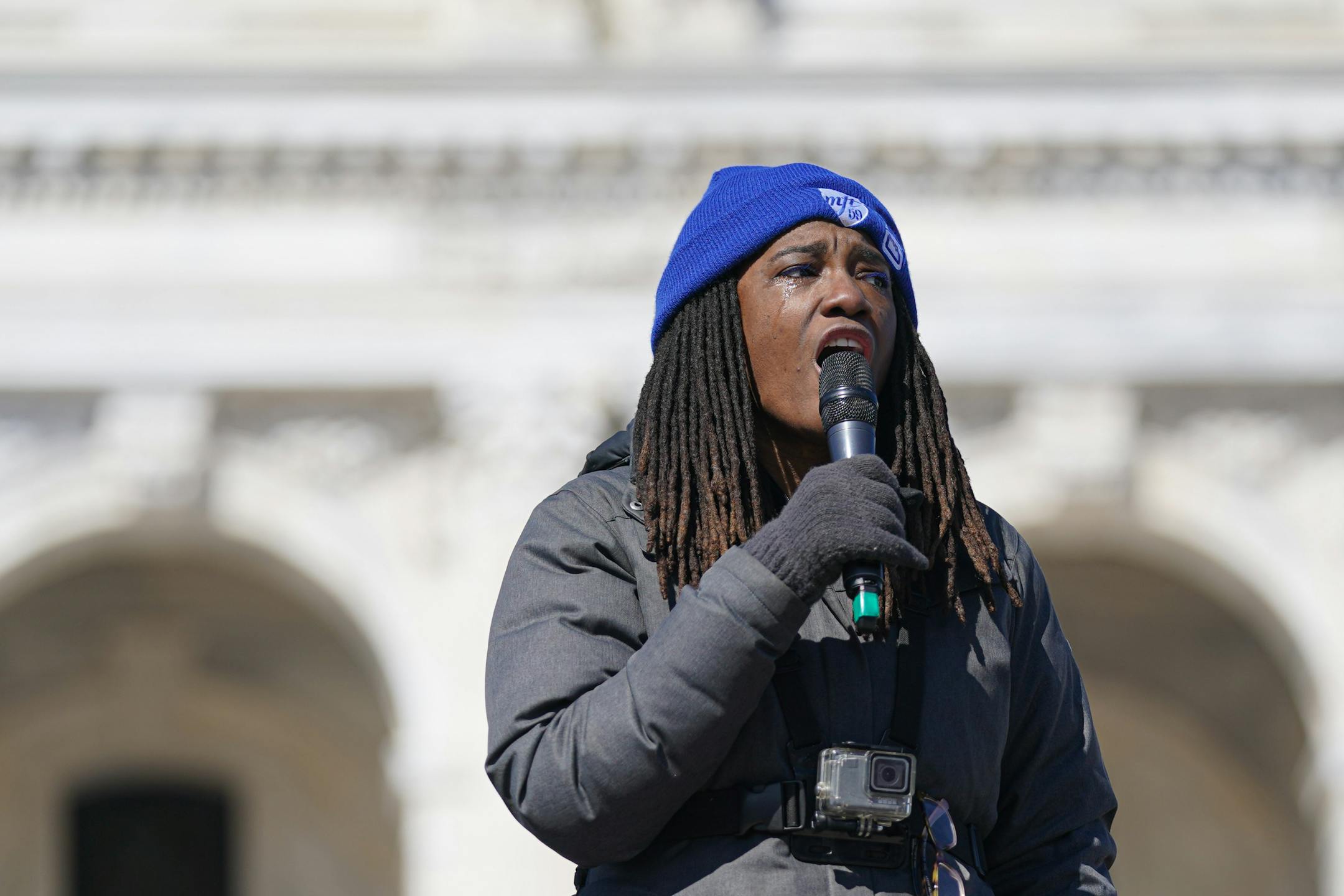 With tears streaming down her cheeks, Marcia Howard, a teacher at Roosevelt High School, spoke at the rally as Twin Cities teachers including MFT, Minneapolis Federation of Teachers Local 59, and ESP, Education Support Professionals, rallied at the Minnesota State Capitol.