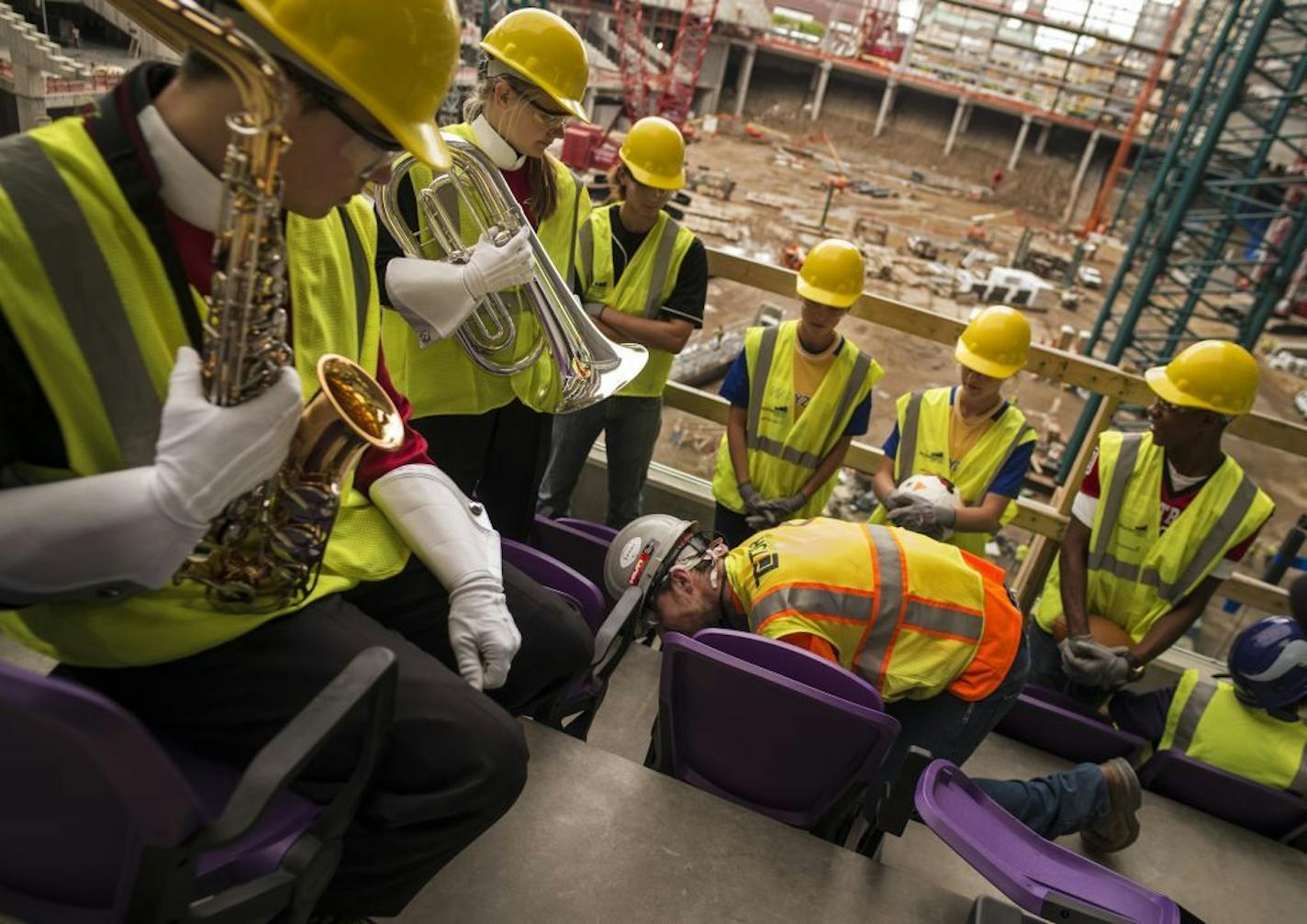 A the new Vikings stadium, a group of high school athletes and band members including Joe Nelson, far left, of Eden Prairie got an opportunity to view some of the first purple seats being installed as well as the progress being made. "This place is huge," said Nelson.